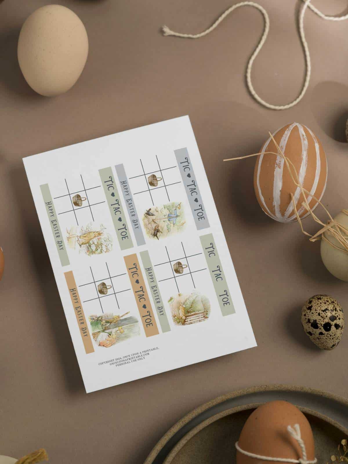 Tic Tac Toe with Peter Rabbit illustrations for Easter, with natural colored eggs and string.