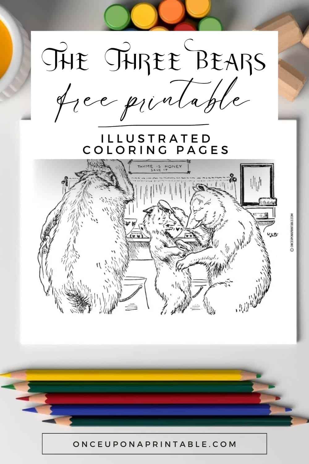 The three bears coloring pages on a white table with coloring pencils.