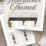 Nutcracker themed 'go fish' cards on a wooden background with white snowflakes.