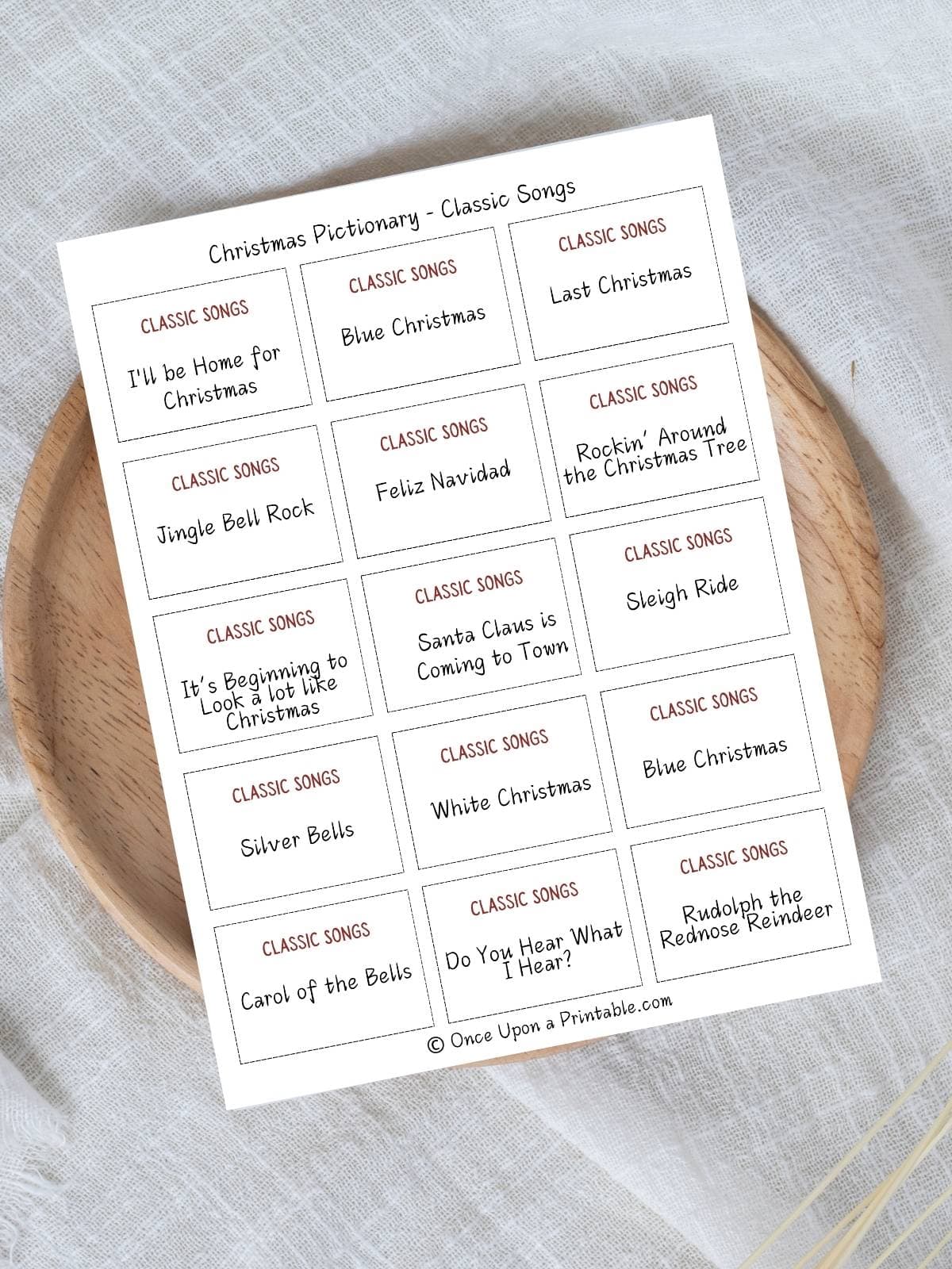 Christmas Pictionary themed game card cover picture with a wreath.