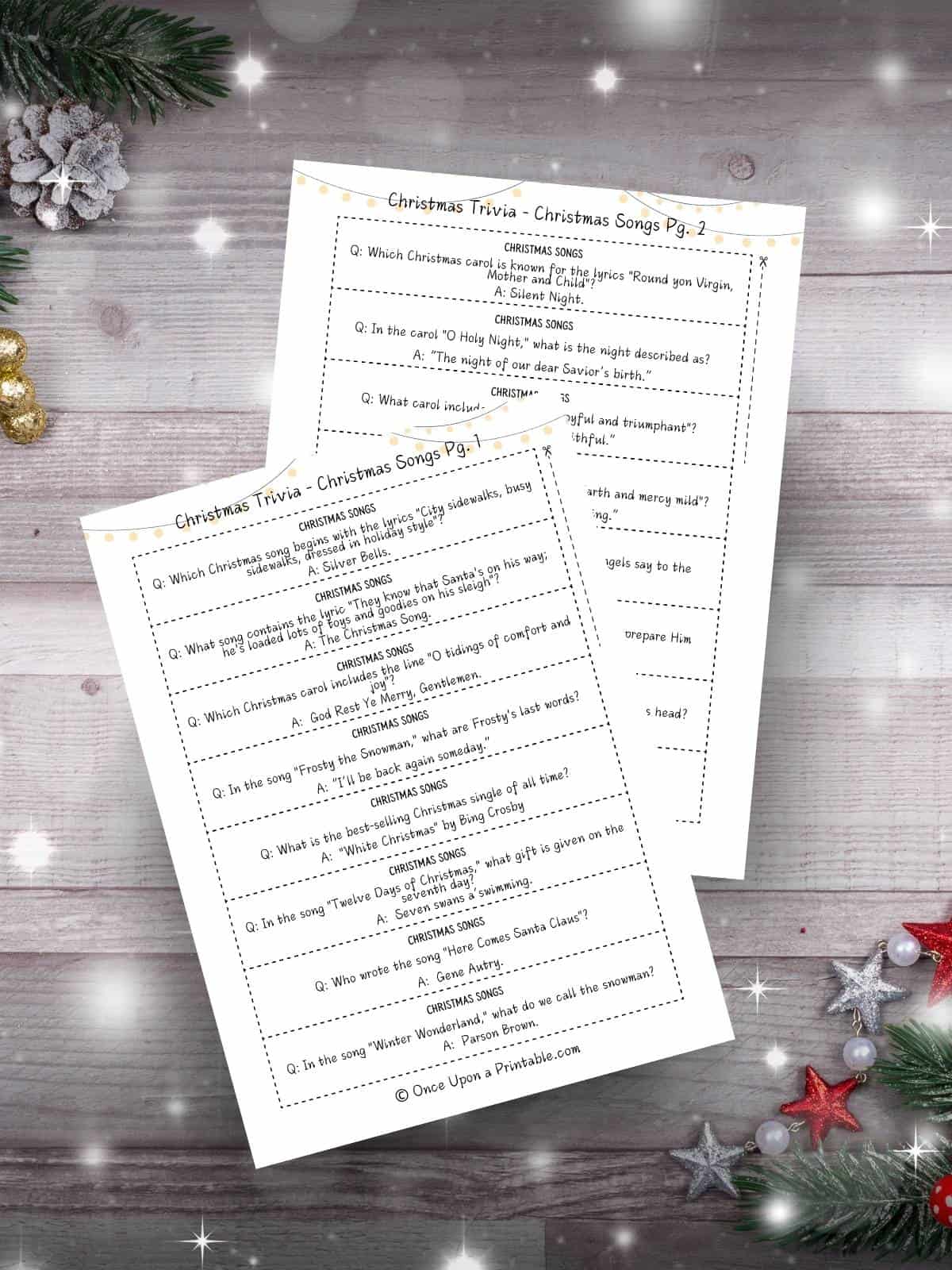 Christmas trivia questions for kids and adults cover photo with a watercolor picture of a family playing games.