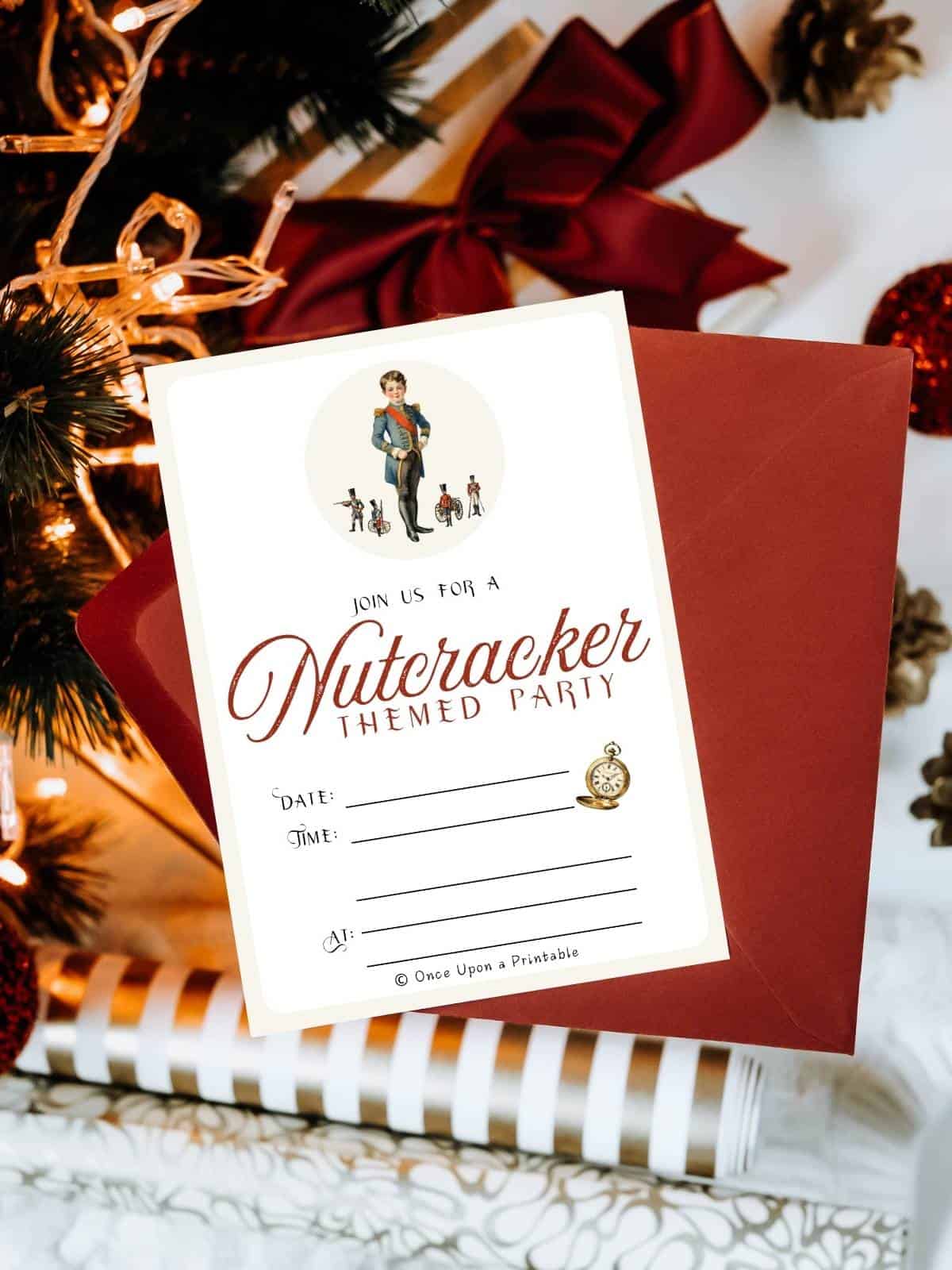 Frederic and his toy soldiers on a Nutcracker themed party invitation on an orange envelope under a christmas tree.