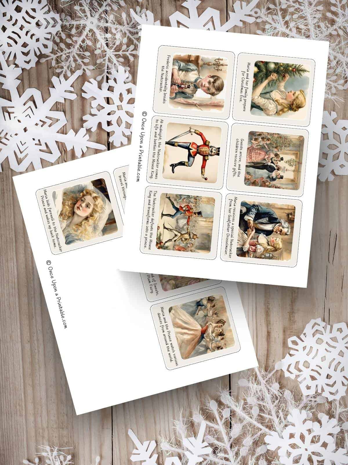 Nutcracker story sequencing printables with beautiful watercolor graphics on a wooden floor with white paper snowflake cut outs.