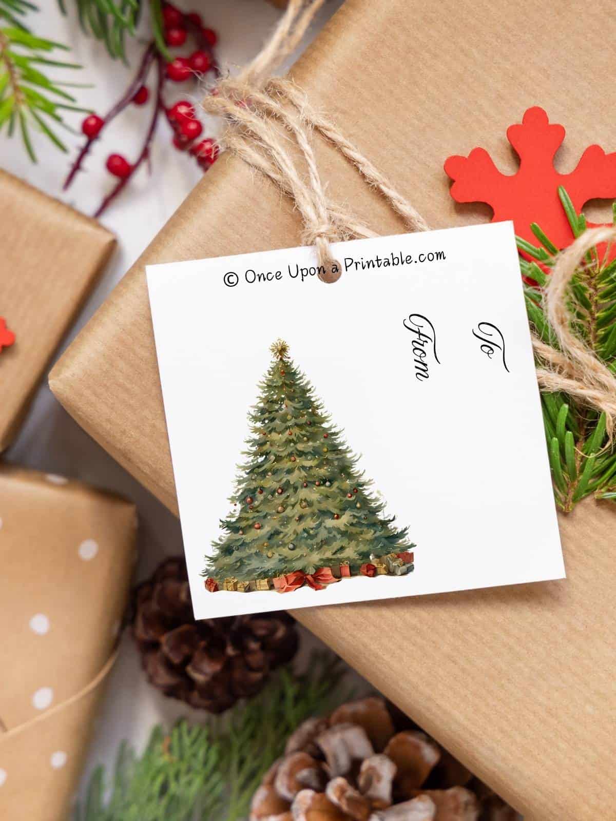 A grand christmas tree decorated with presents underneath from the Nutcracker story on a gift tag on a present.