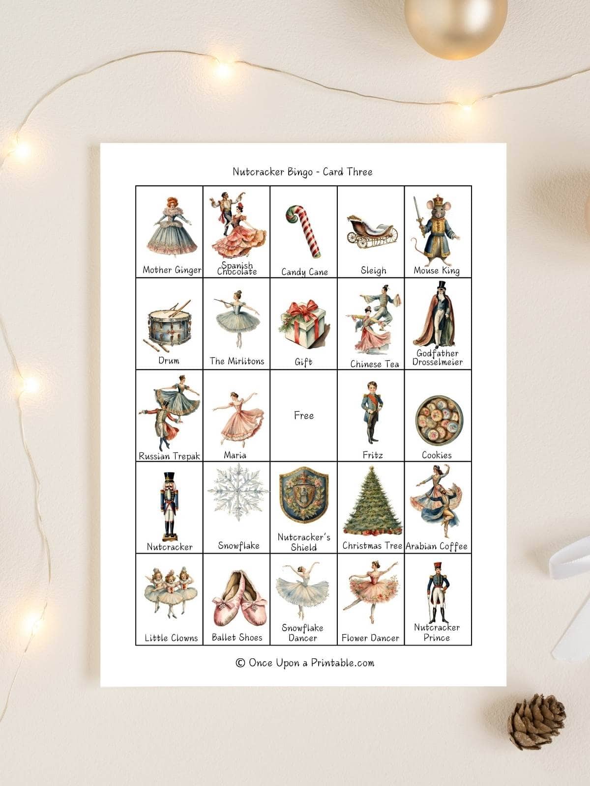 Nutcracker themed bingo card displayed with some twinkle lights.