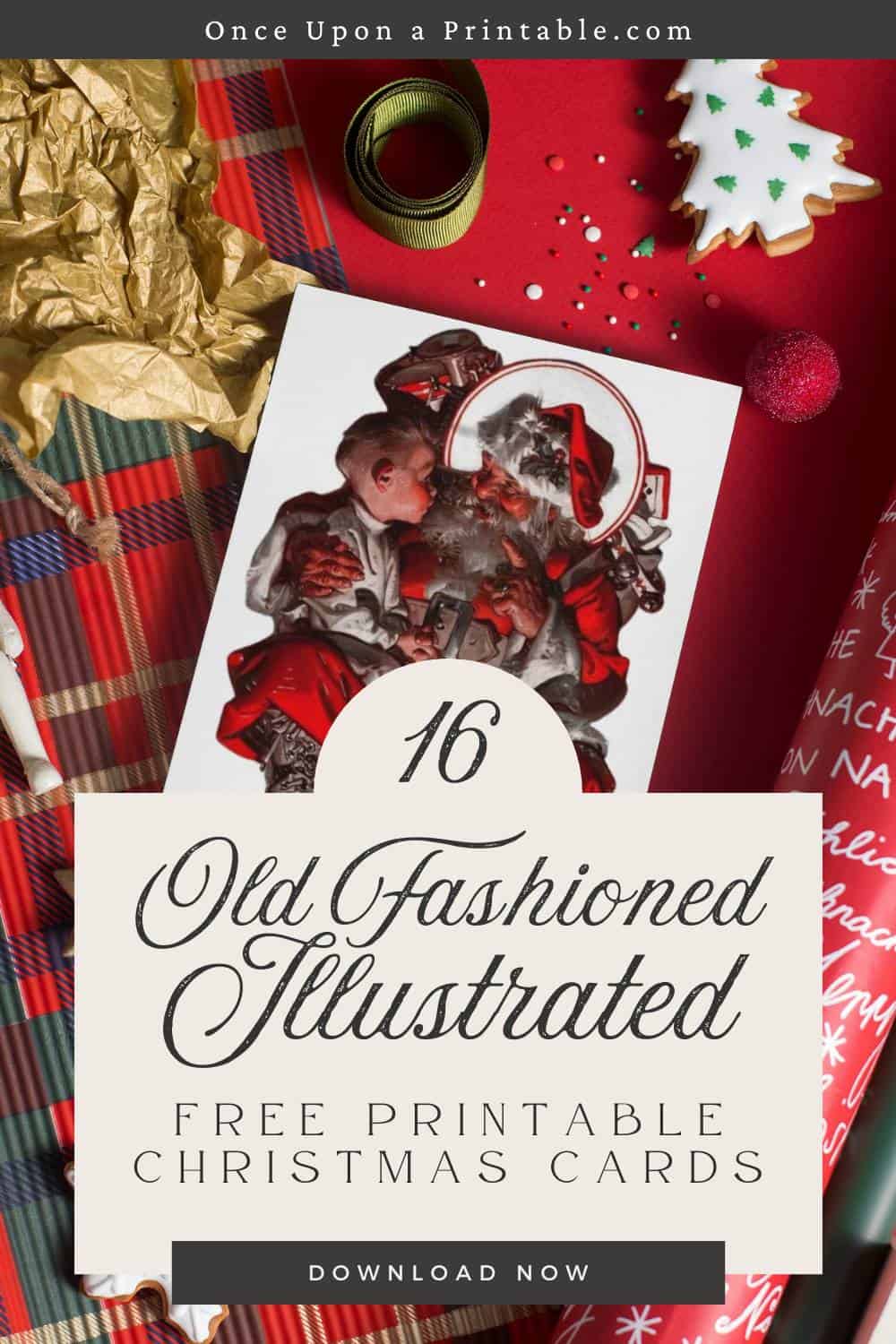 Santa Claus with a little boy sitting on his lap, a greeting card displayed on red Christmas wrapping.