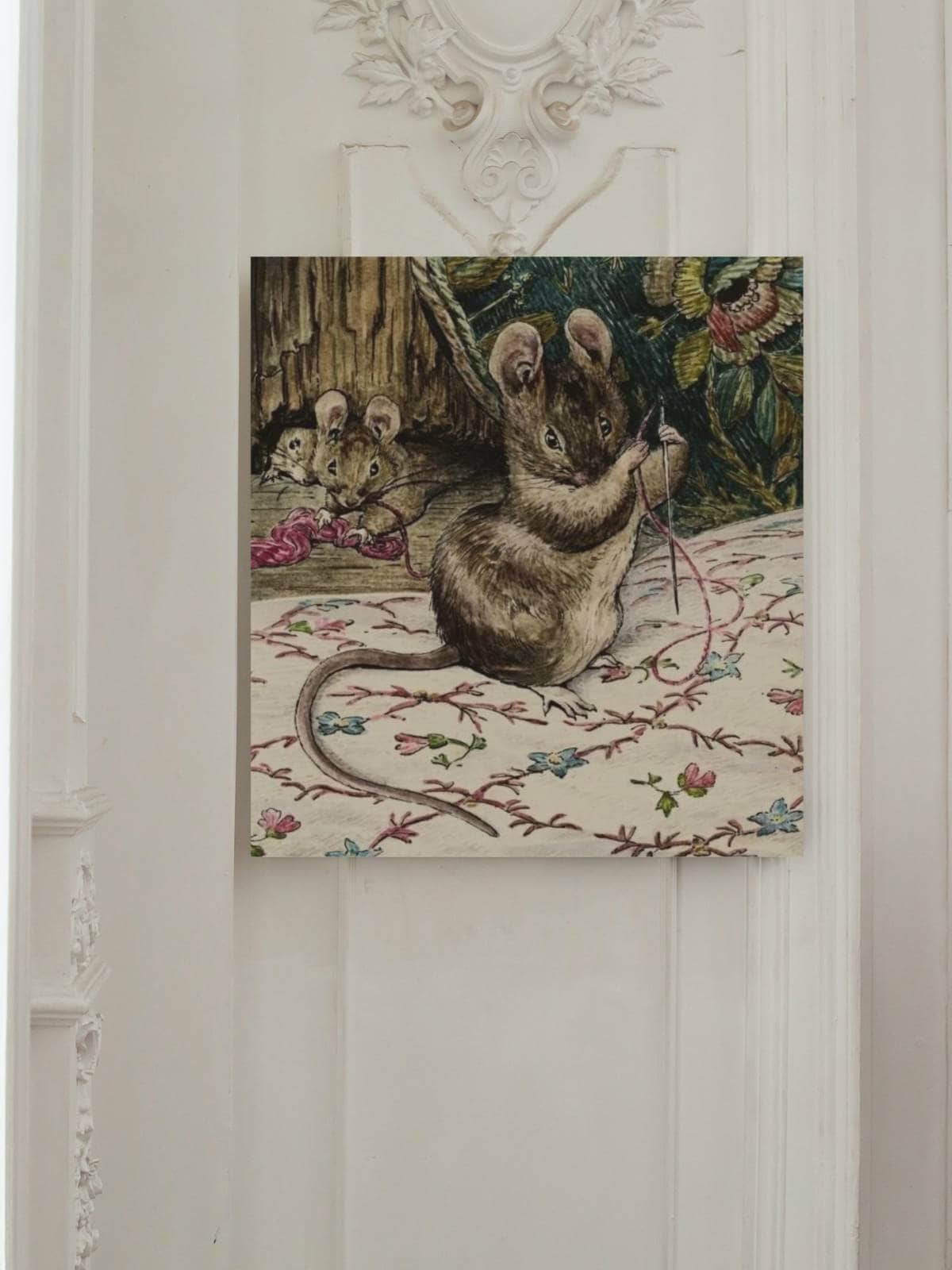 An illustration by Beatrix Potter of a mouse threading a needle from the Tailor of Gloucester.