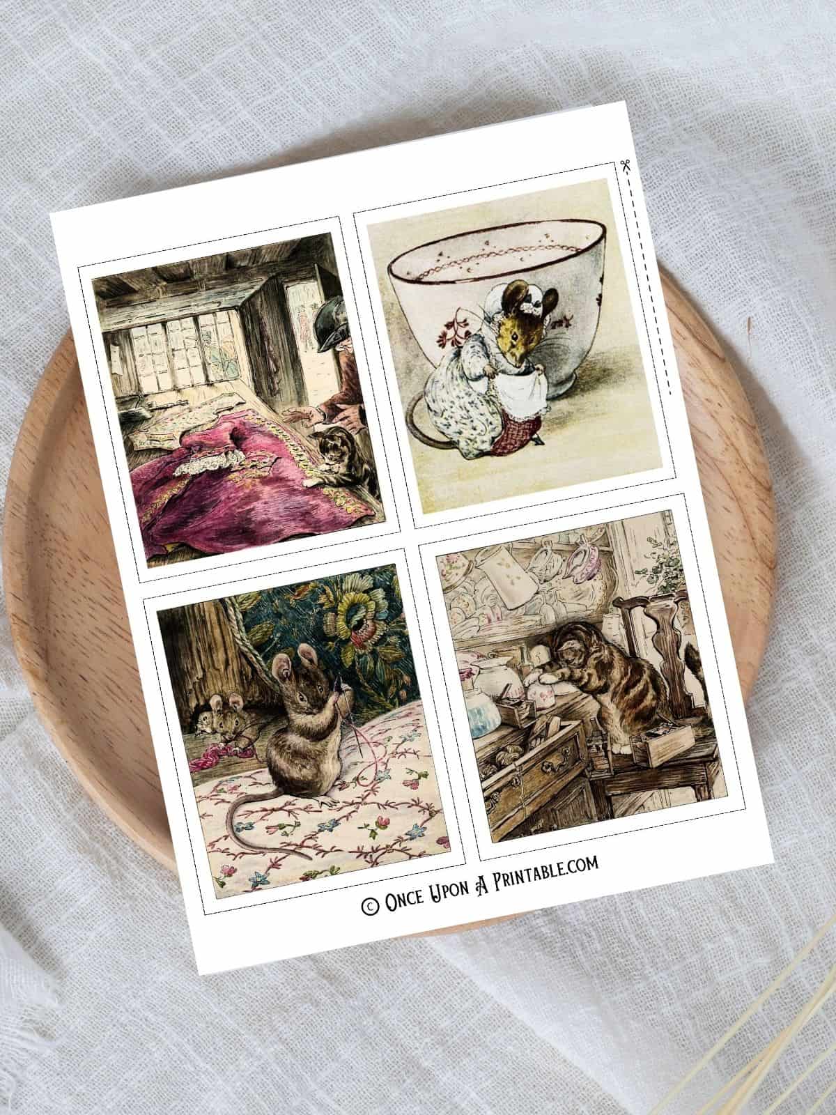 Beatrix Potter's illustrations from the Tailor of Gloucester storybook printed and sitting atop a wooden lazy susan on a white tablecloth.