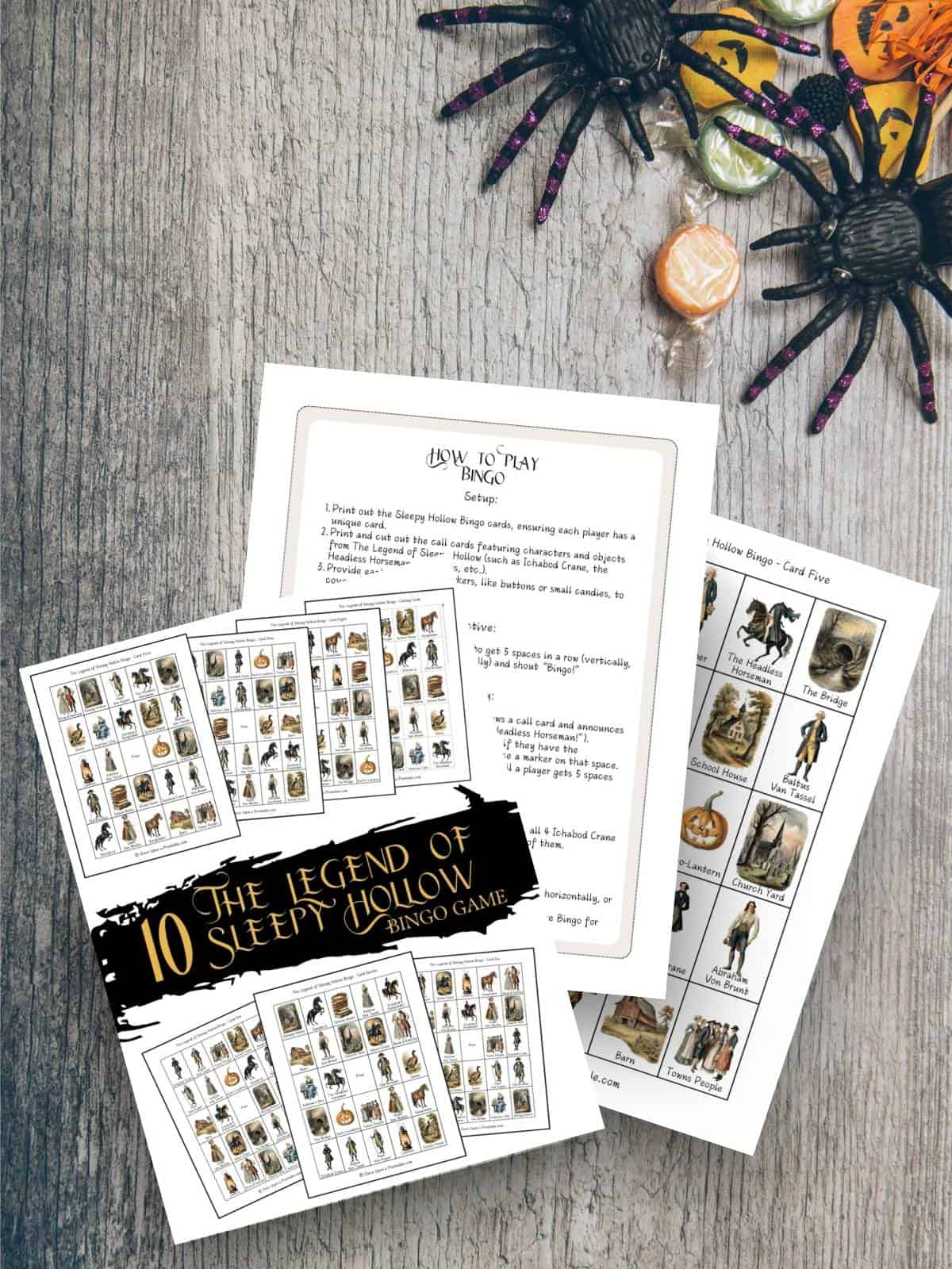 The Legend of Sleepy Hollow Bingo game printables on a wooden table with spiders and Halloween candy.
