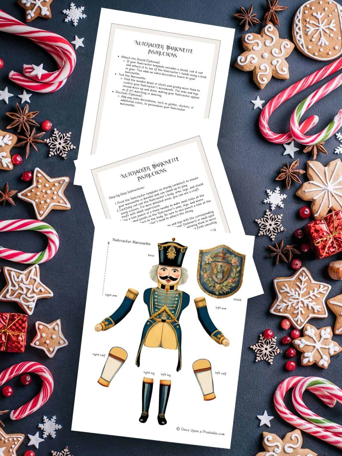 A Nutcracker marionette activity to print out and put together displayed on a navy background with candy canes and gingerbread cookies.