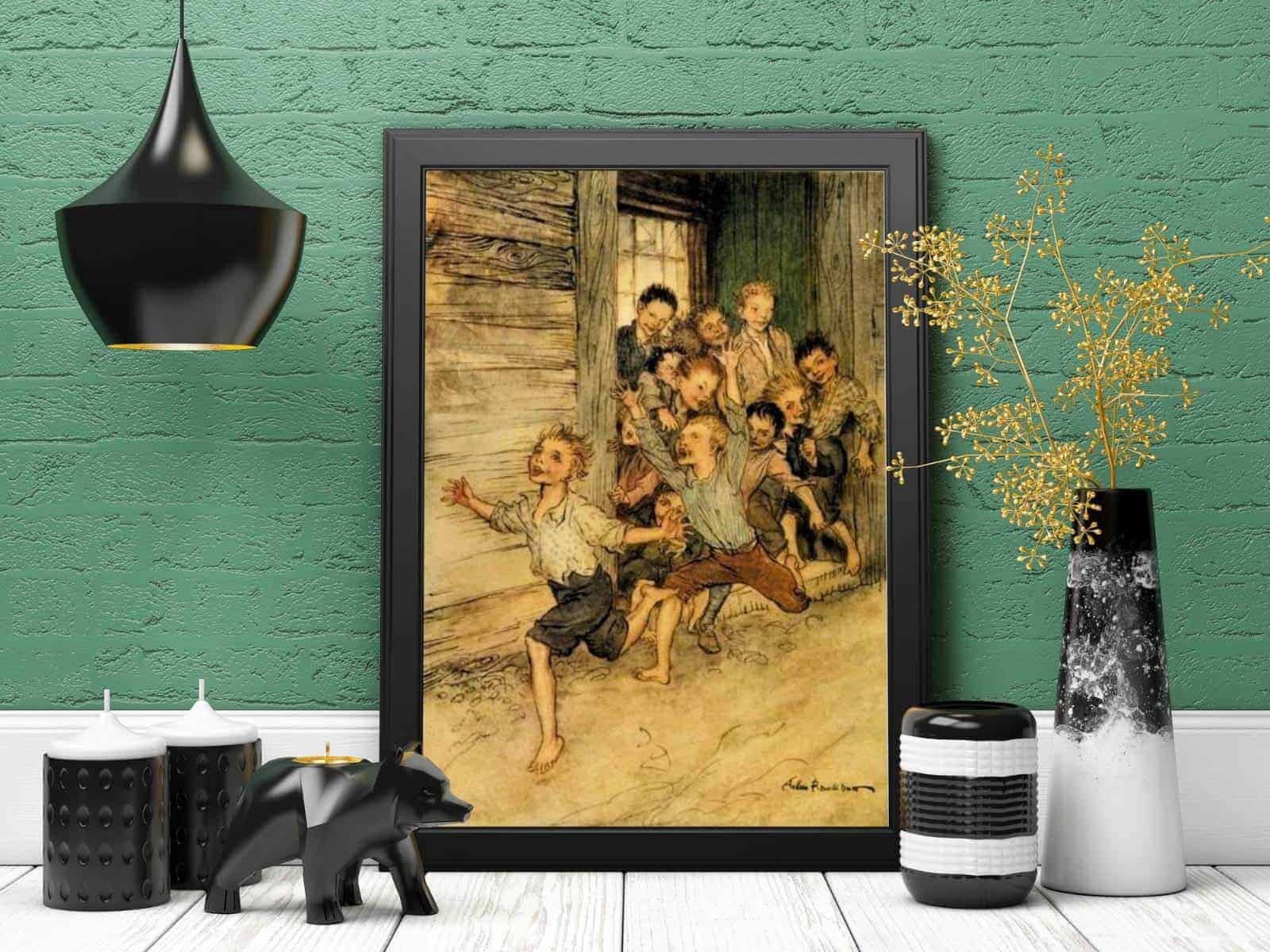 The Legend of Sleepy Hollow illustration of boys running out of their school house by Arthur Rackham, framed and displayed on a white countertop next to black and white decor.