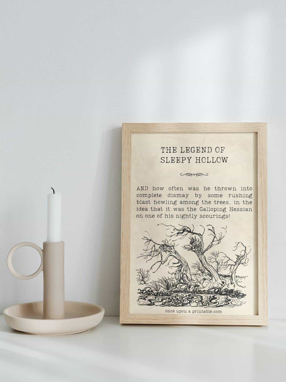 A sleepy Hollow Quote framed and displayed next to a creamy candlestick holder.
