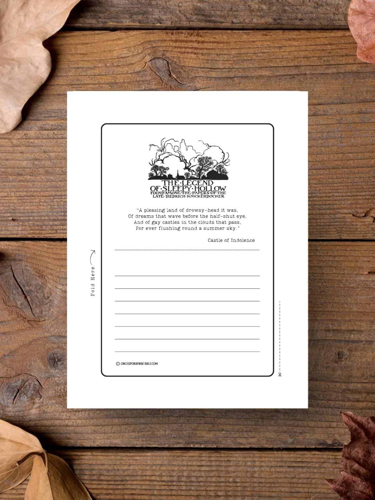 The front black and white illustration to the book the legend of Sleepy hollow on stationary illustrated by Arthur Rackham, displayed on a wooden table with fall leaves.