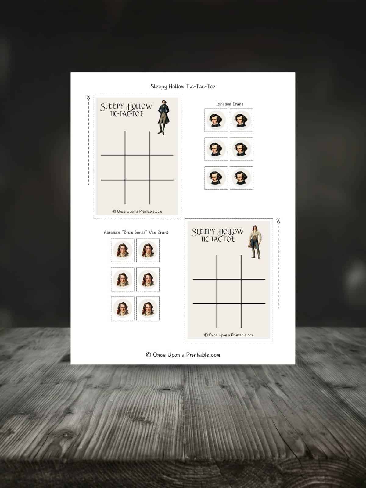 Legend of Sleepy Hollow tic tac toe game printable on a wooden table.