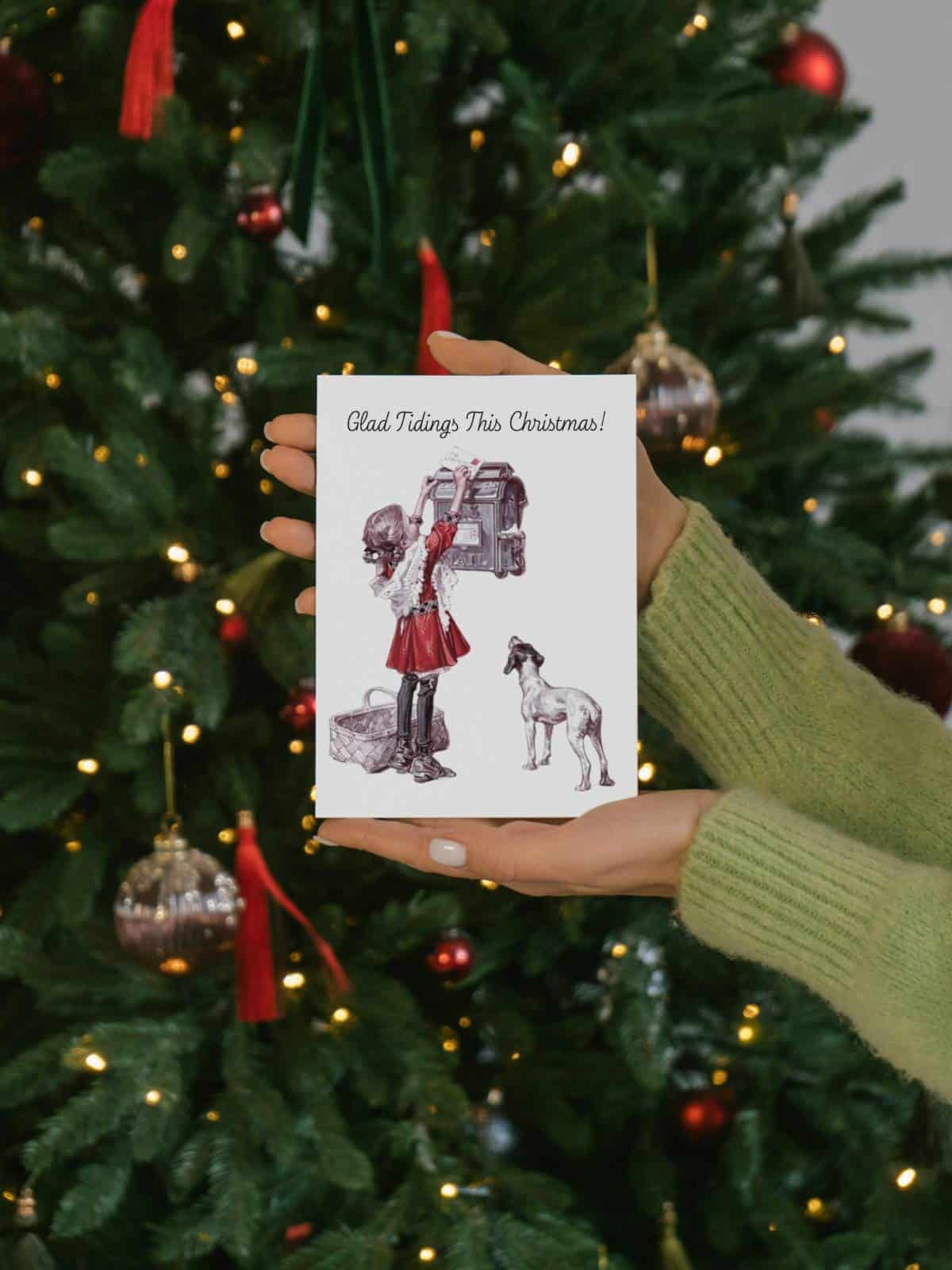 Vintage illustration of a little girl putting a letter to Santa in the mail box with her puppy by her side, a greeting card being held in a woman's hand by a Christmas tree.