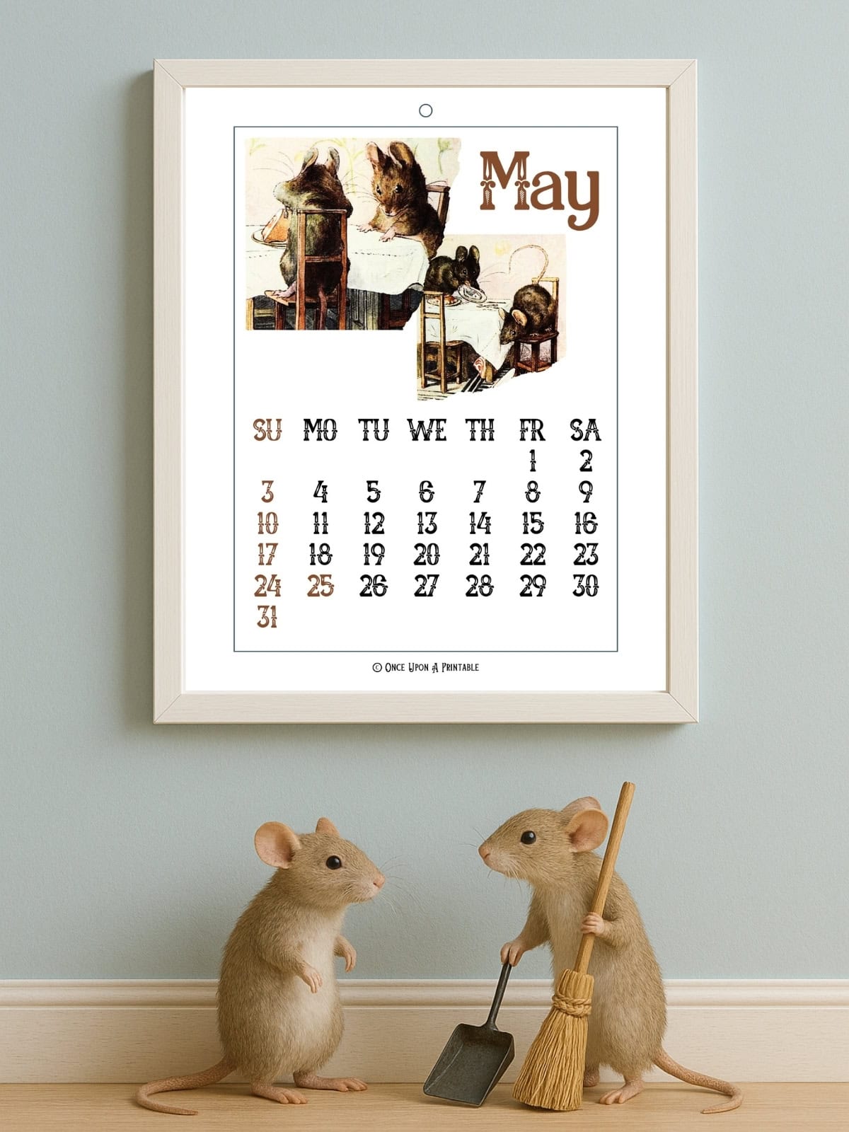 The tale of two bad mice February edition framed and displayed next to a case and a calendar.