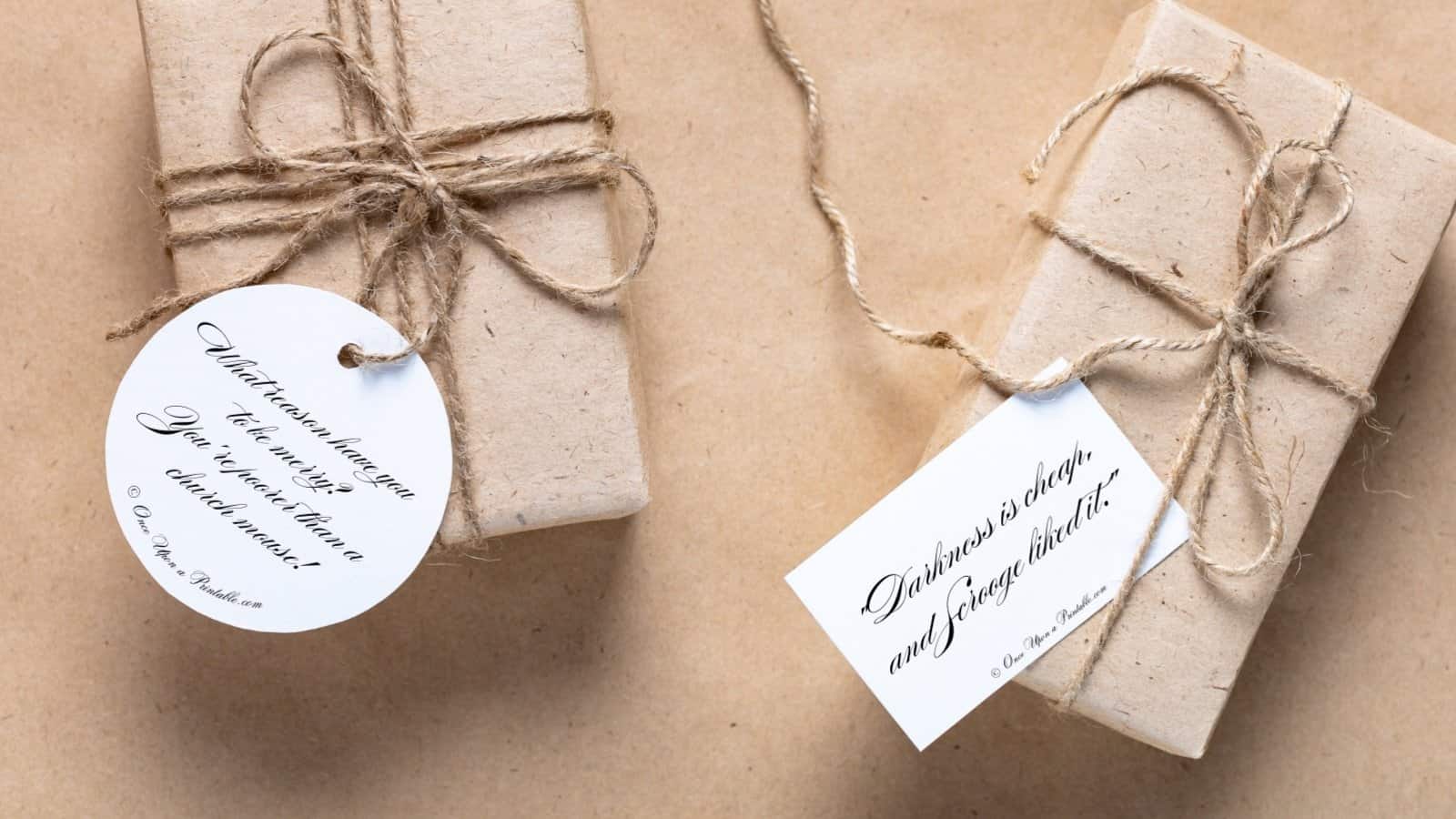Two scrooge grouchy sentiment christmas gift tags on brown paper packages tied up with string.