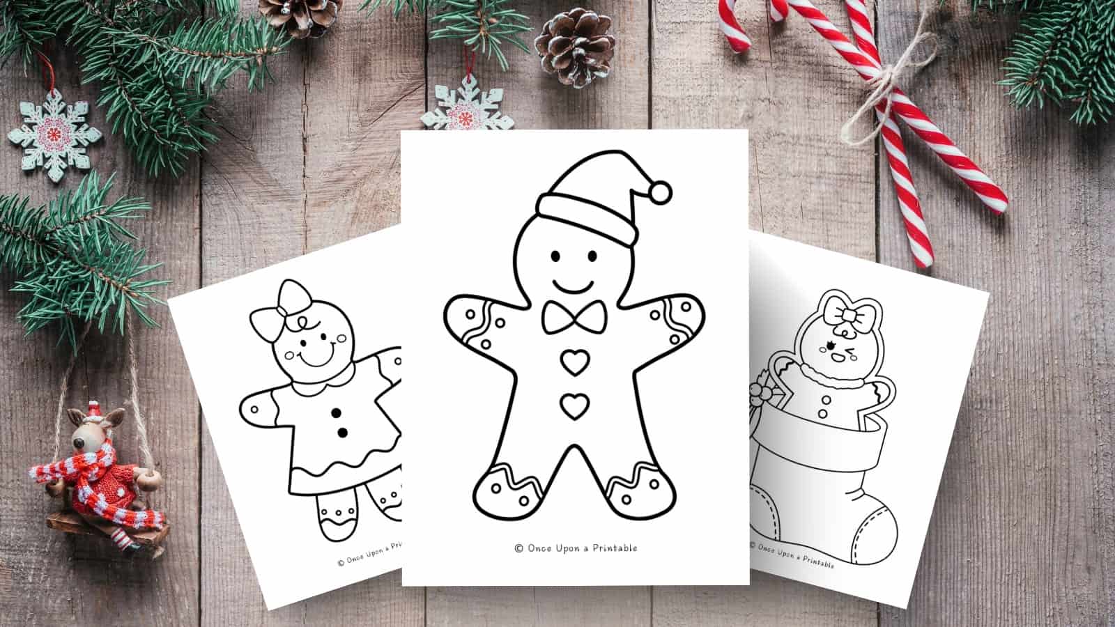 Gingerbread boy, girl, and baby coloring pages displayed on a wooden background with ornaments and greenery.