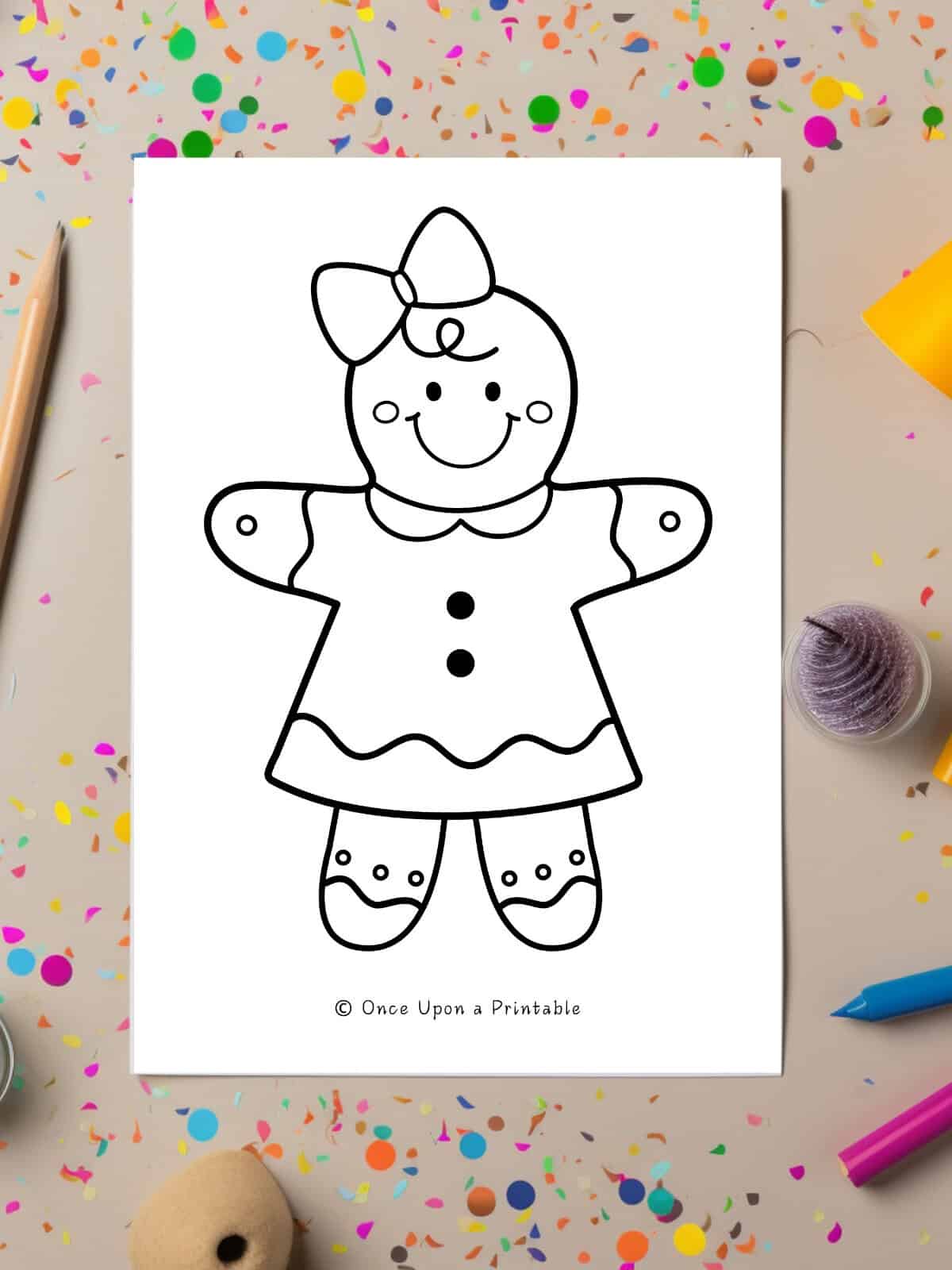 Gingerbread girl coloring page sitting on coloring tools.