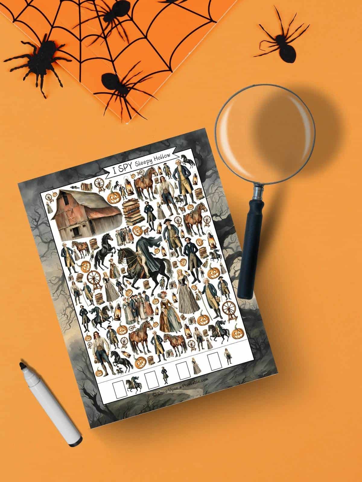 Sleepy Hollow I spy harder version with spiders and spiderweb also a magnifying glass and a pen.
