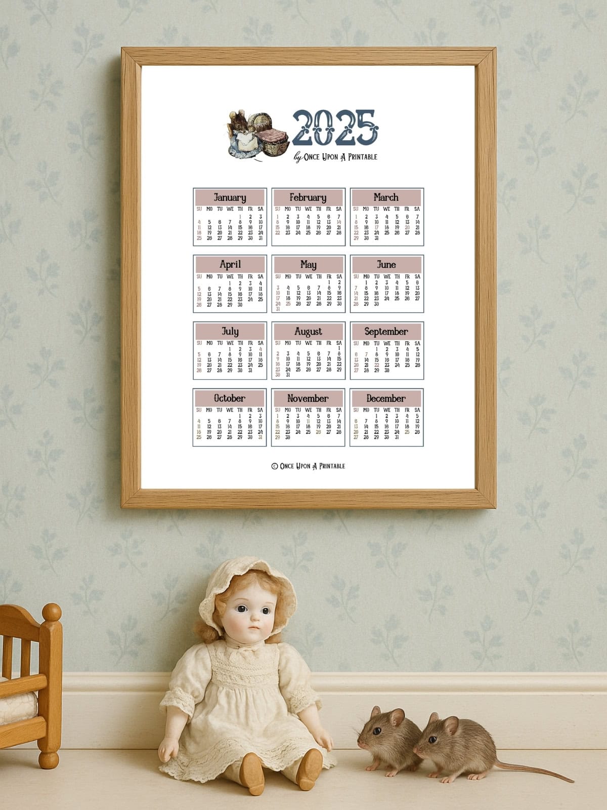 The tale of two bad mice year at a glance calendar framed and displayed on a wall next to a clock.