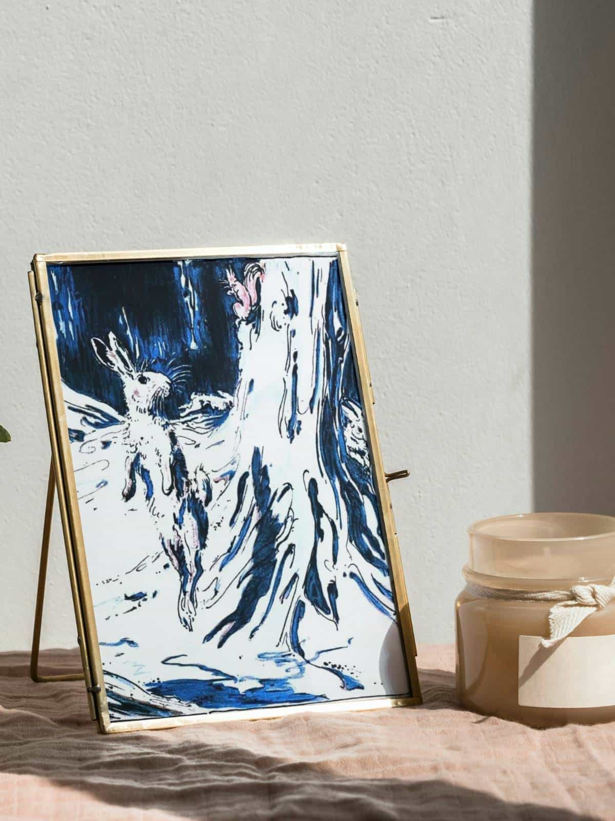 Vintage framed art print of the Velveteen Rabbit with blue tones, framed.