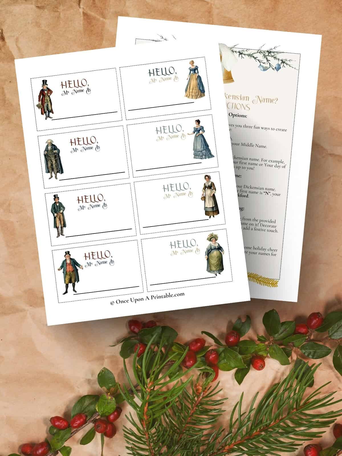 Charles Dickens' characters in watercolor graphics on name tags with instructions on how to play the victorian-inspired name game laying on a kraft paper and Christmas garland.