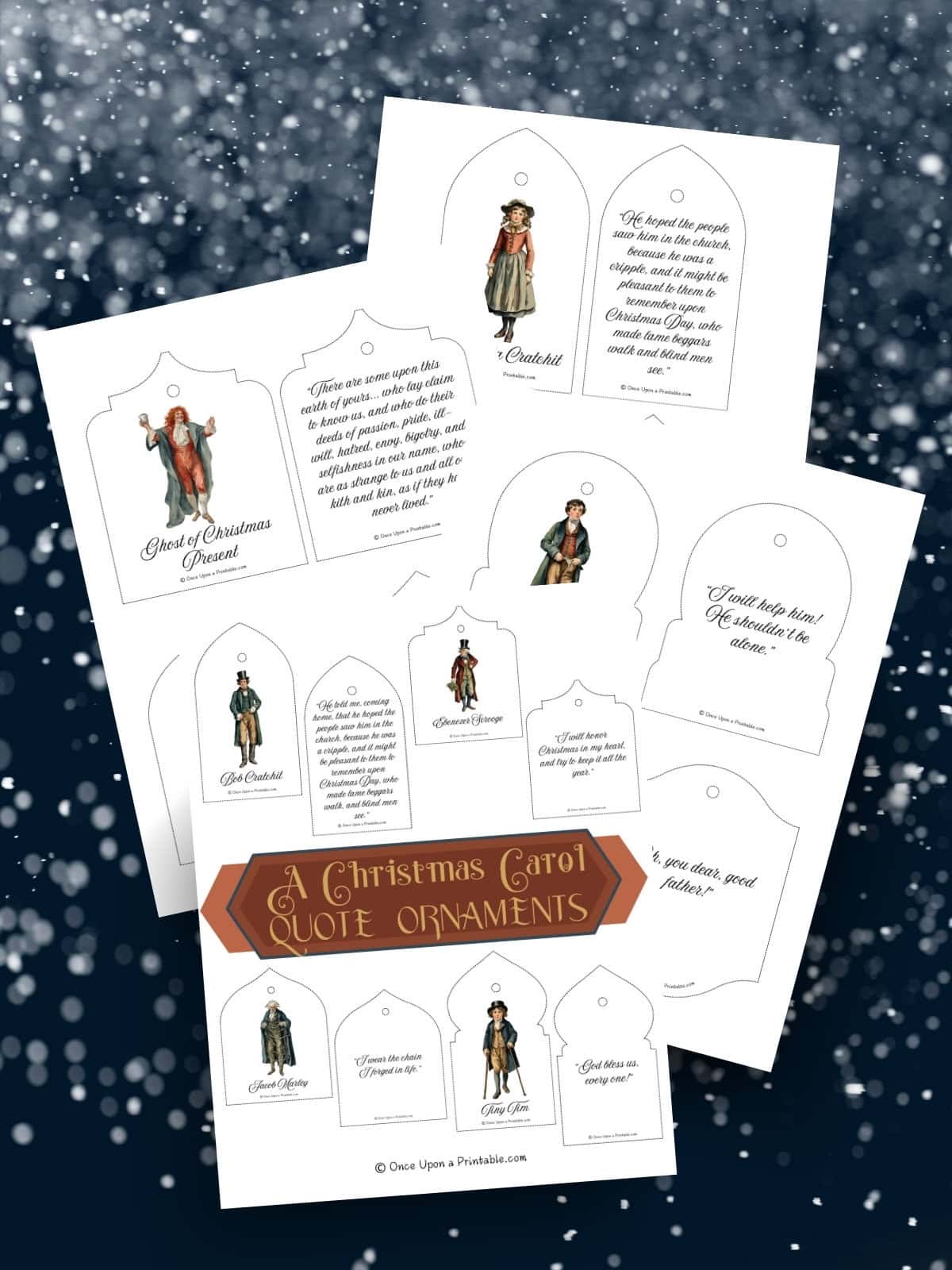 A Christmas Carol christmas ornament pages laying on top of a blue and snowy background.