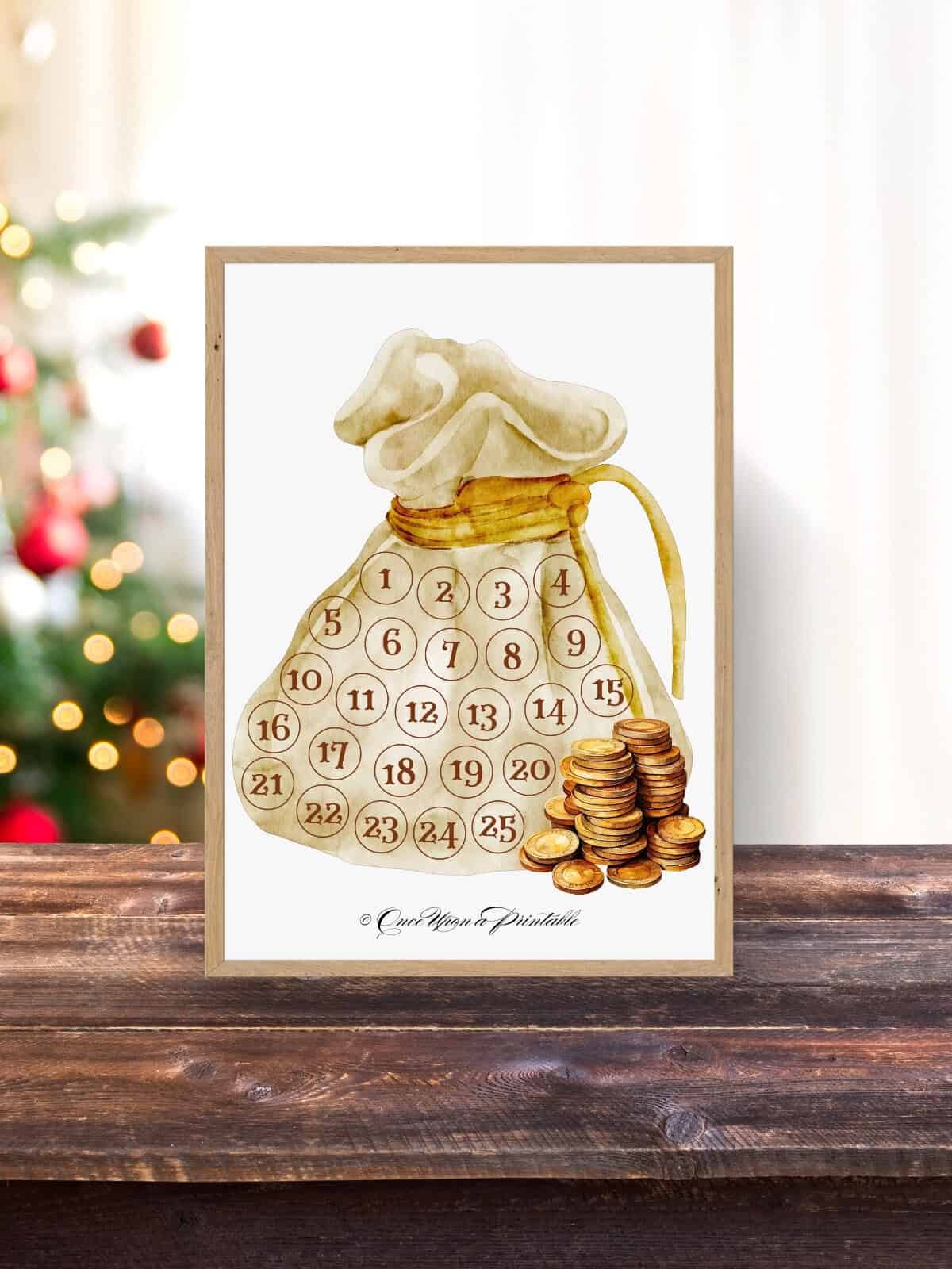 Ebenezer's coin purse printable in a frame sitting on a wooden surface.