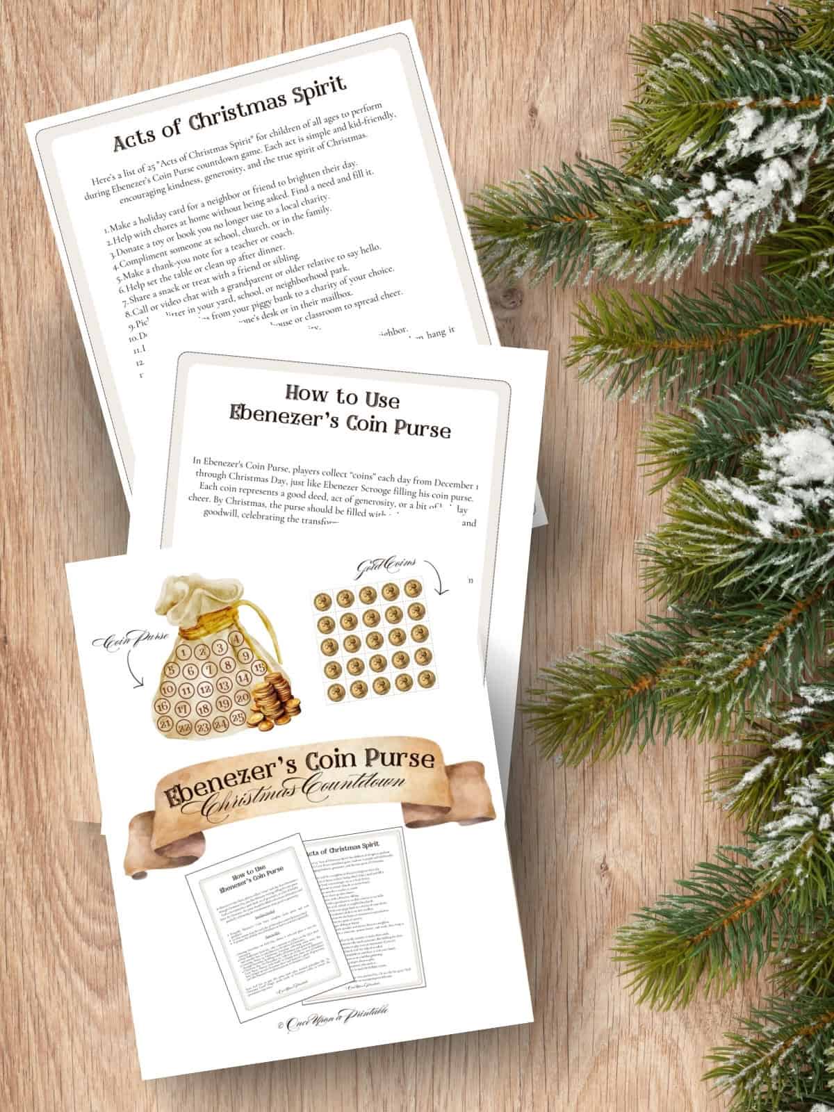 Ebenezer's coin purse christmas countdown printables laying on a wooden surface next to Christmas garland.