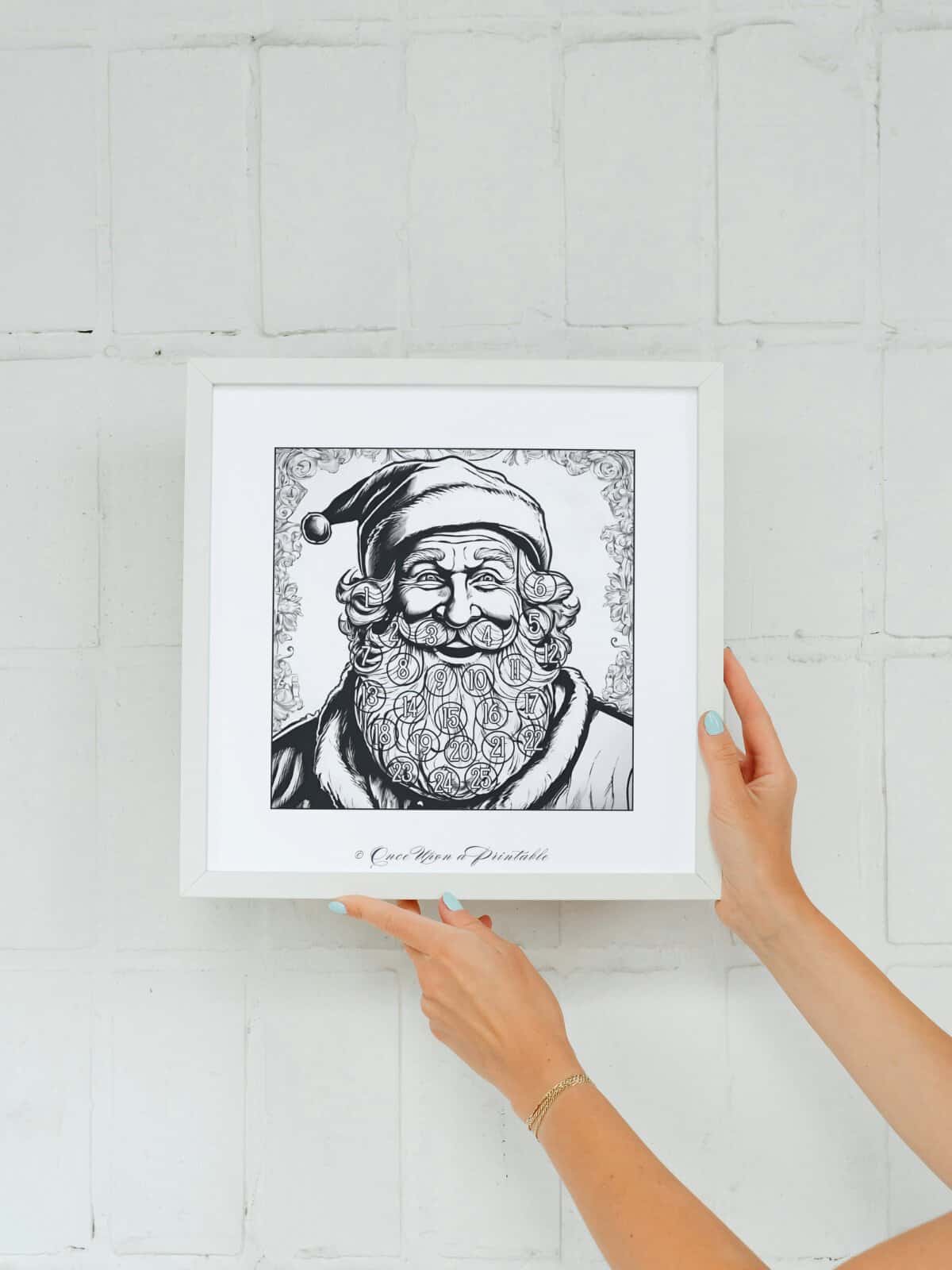 Happy old fashioned santa beard countdown calendar in a square frame being held in a woman's hands.