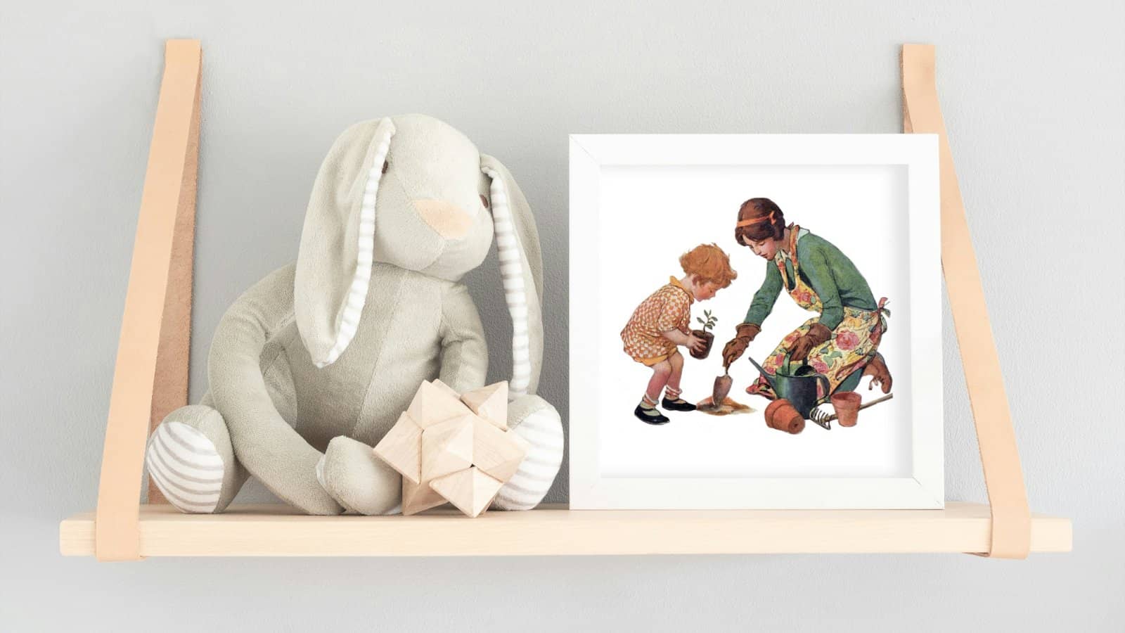 A vintage illustration framed of a mother and child gardening, by Jessie Willcox Smith.