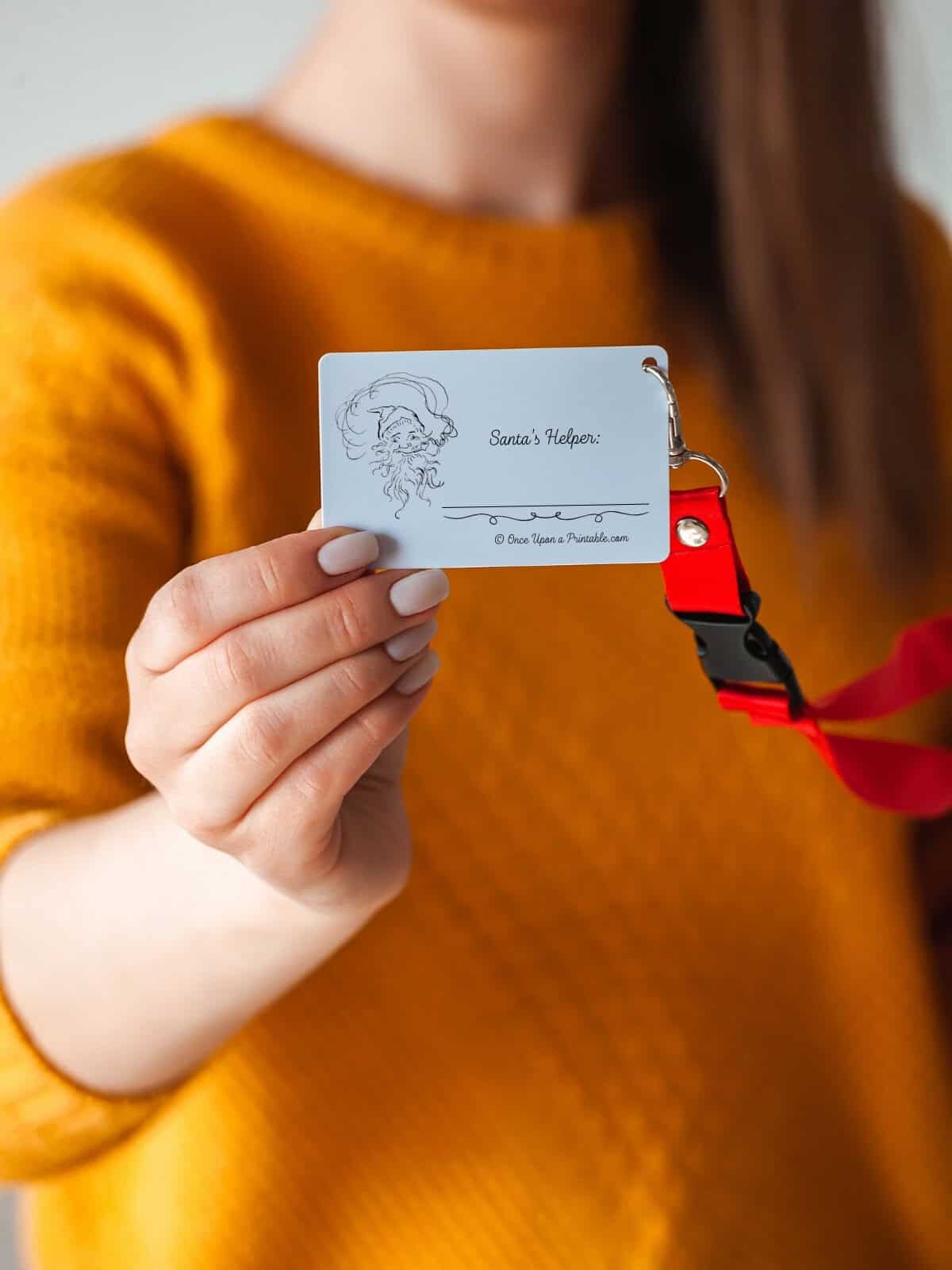 "Santa's Helper" name tag illustrated by Arthur Rackham.