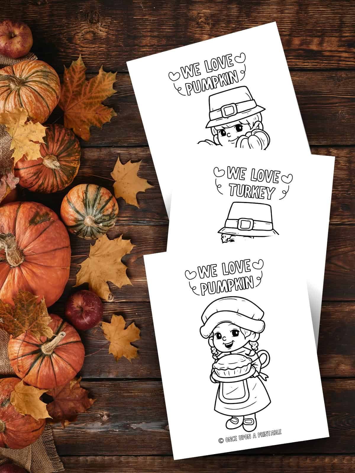Simple thanksgiving themed pilgrim and pumpkin coloring pages on a wooden surface with fall leaves and pumpkins.