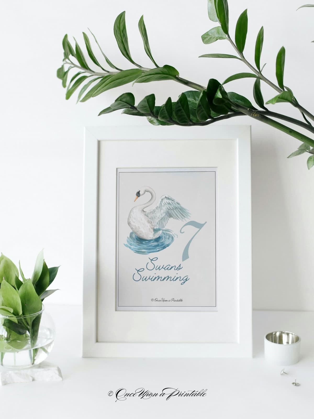 A beautiful watercolor framed art print of the #7 day of Christmas, swans swimming.