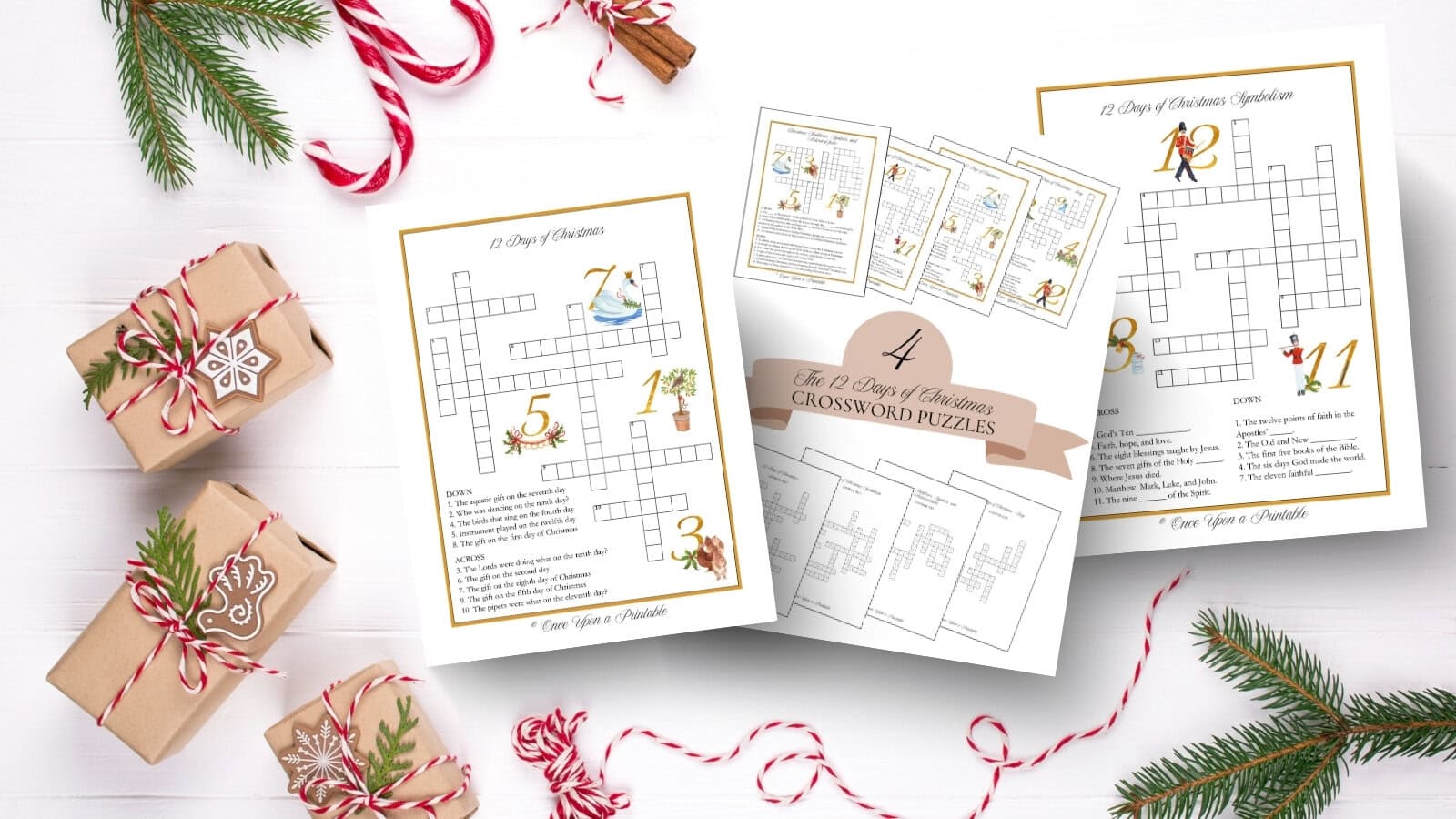 The 12 Days of christmas illustrated crossword puzzles and cover page laying on a white table with brown paper packages tied with string and garland.