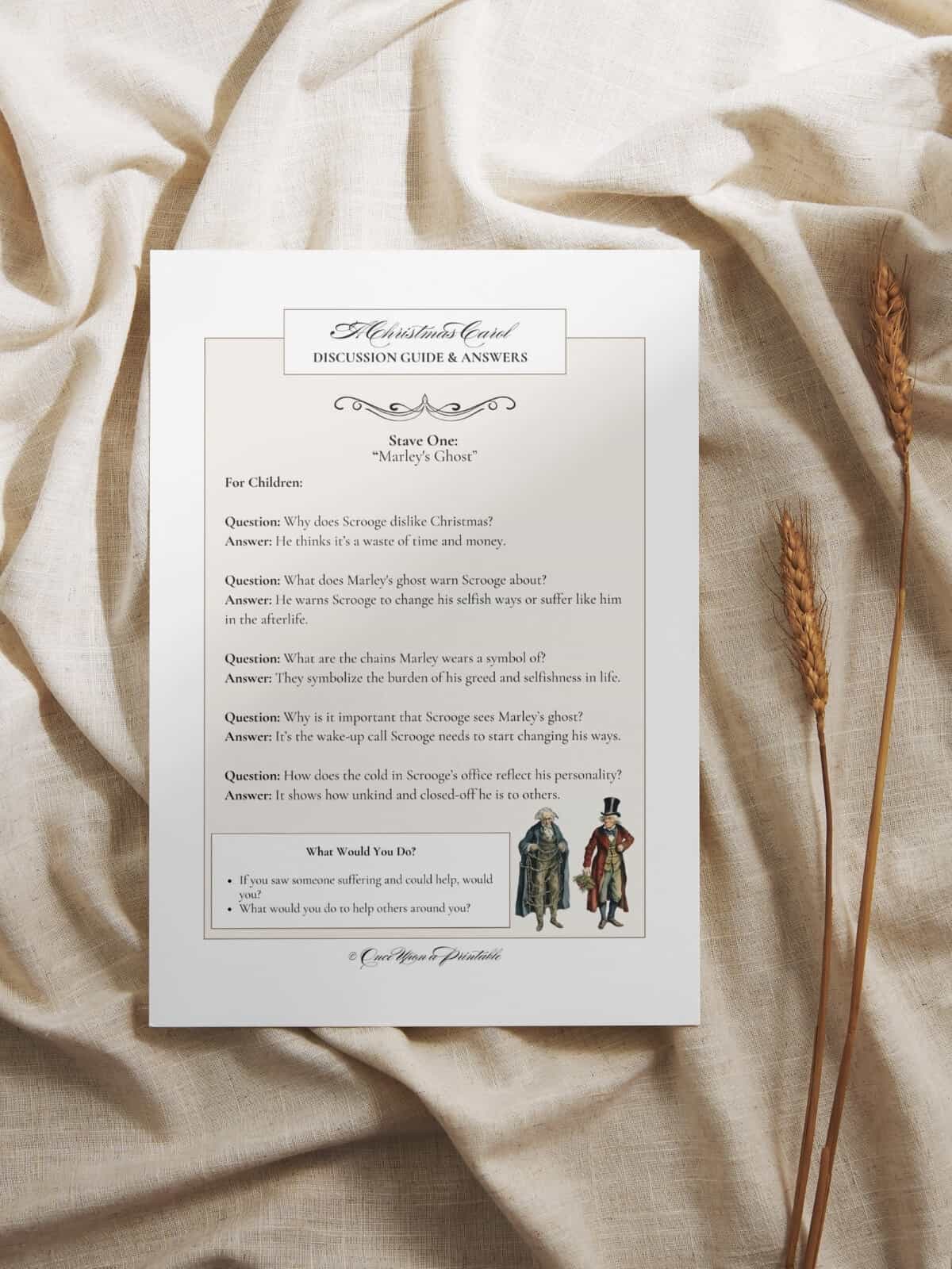 A Christmas Carol, stave one, discussion guide and answers laying on a creamy blanket.