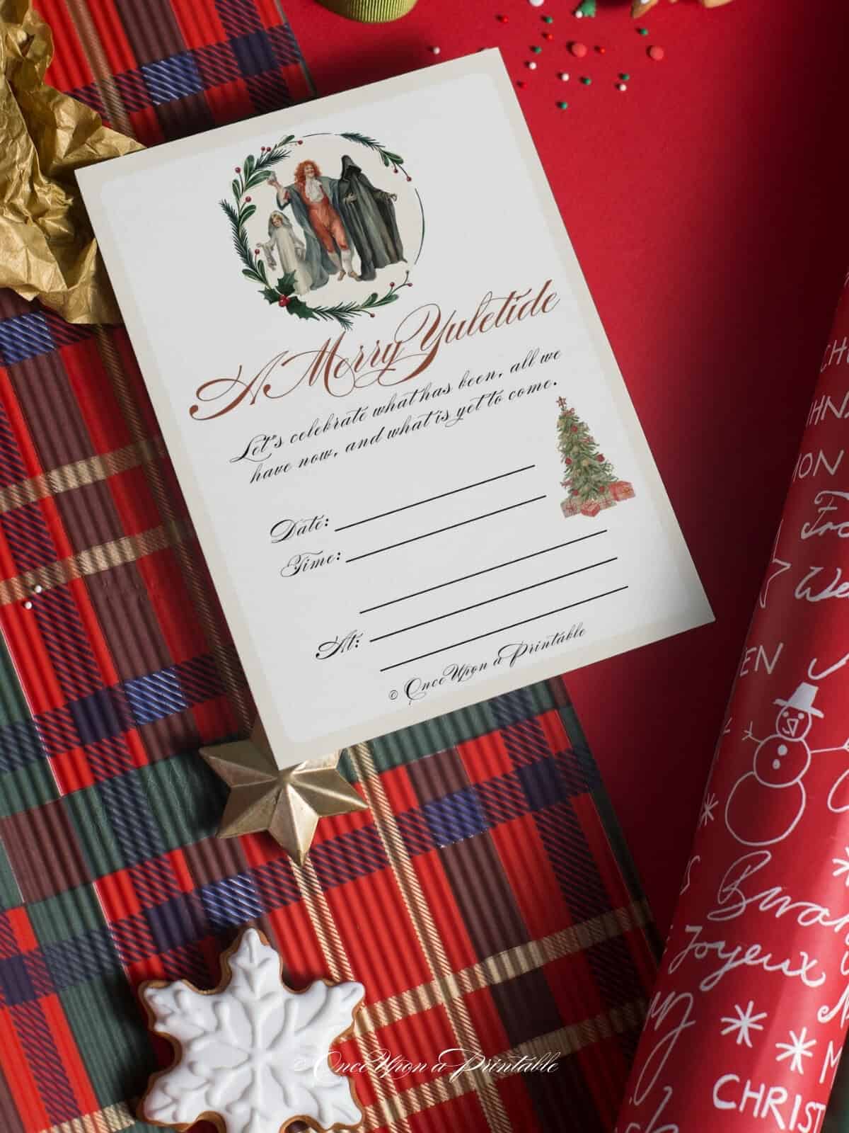 A Christmas Carol themed Christmas party invitation with the ghost of Christmas laying on a plaid christmas wrapping paper.