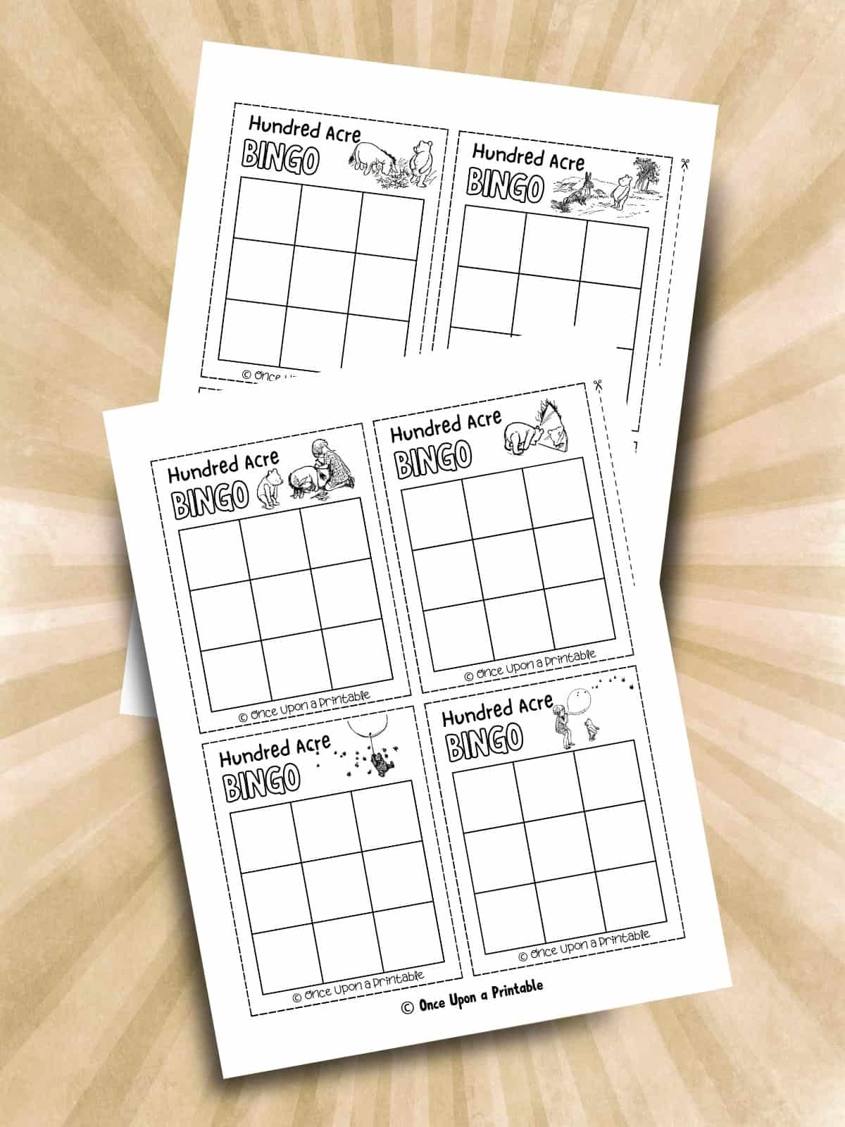 Classic "Pooh" bingo card games that are blank, laying on a brown surface.