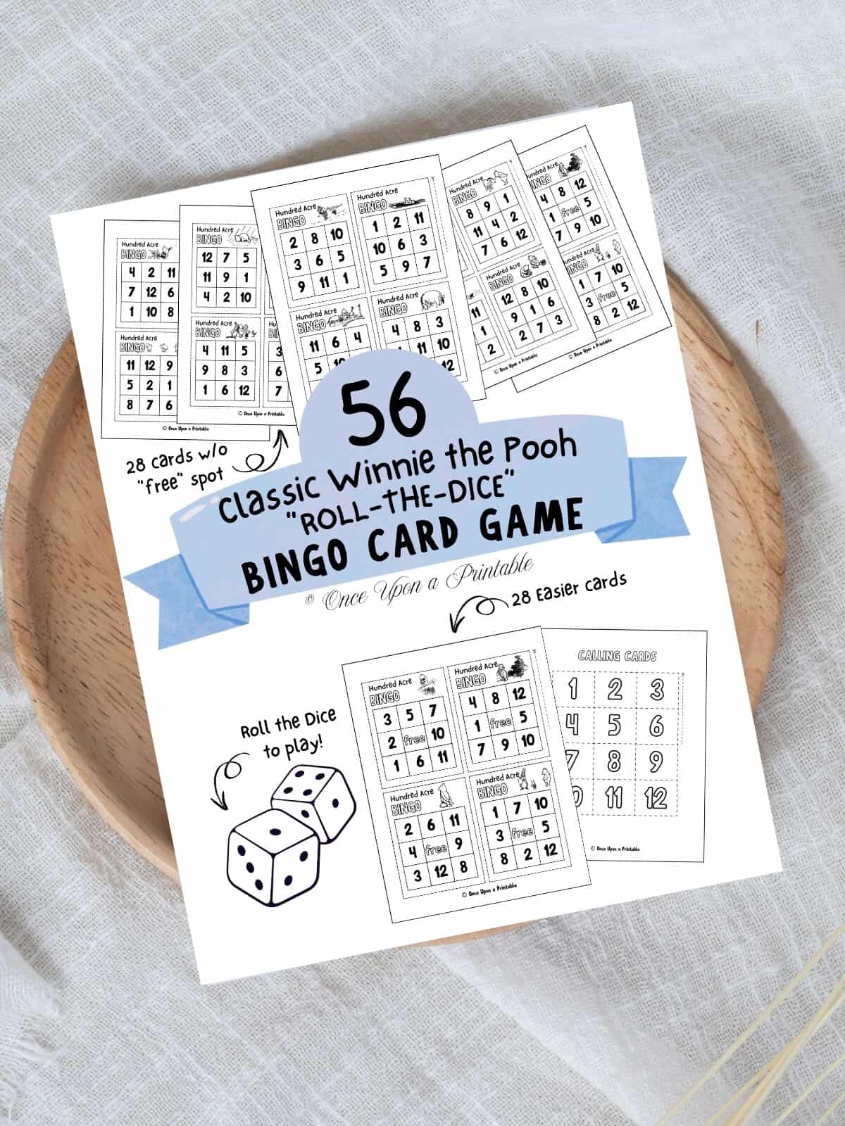 Classic winnie the pooh illustrated bingo cards cover page laying on a wooden lazy susan on a white table cloth.