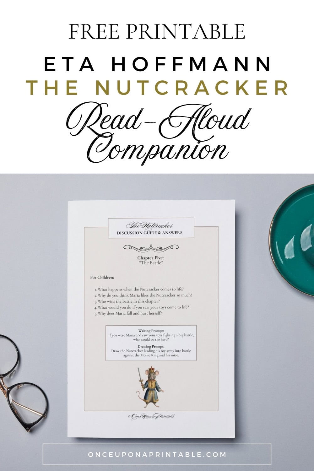 The nutcracker companion guide printed and laying on a table top with glasses and a cup.