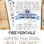 Hundred Acre Bingo, classic winnie the pooh bingo game printable with cover page. Laying on a wooden table with coloring supplies like pencils.