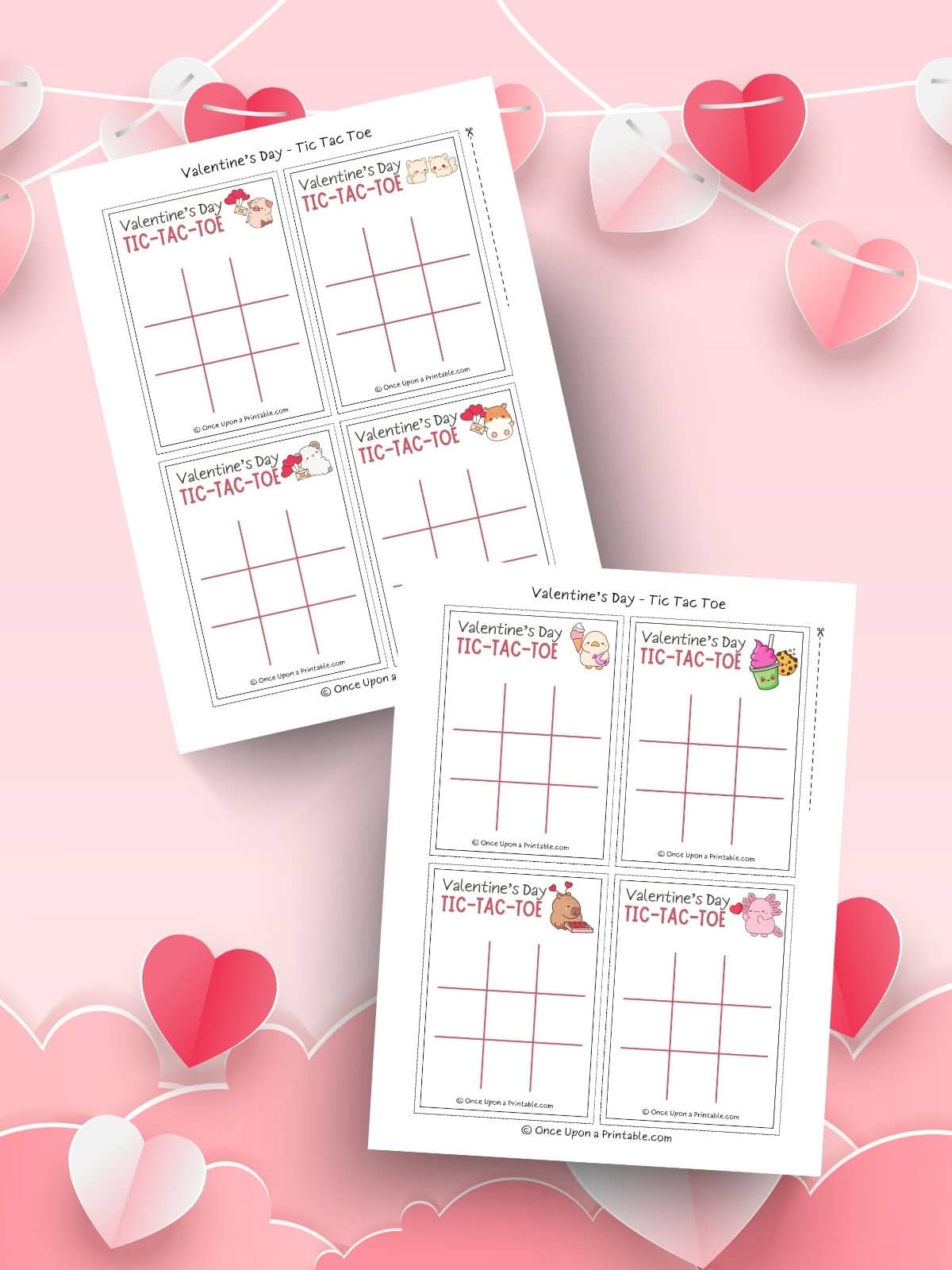 Kawaii graphic tic tac toe valentine's cards on a pink background with hearts.