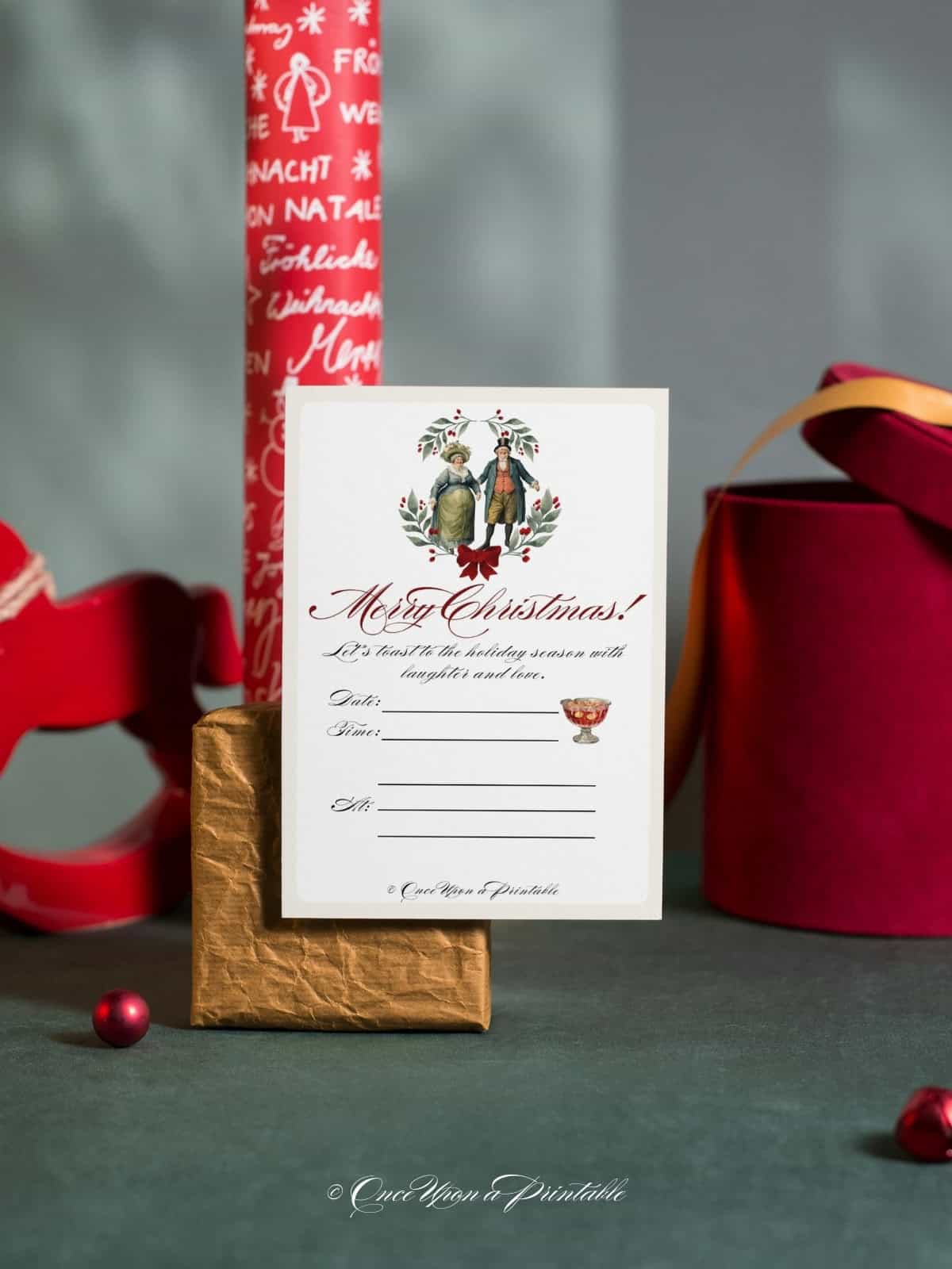 The Fezziwigs themed Christmas party invitation with Christmas wrapping paper and a box.