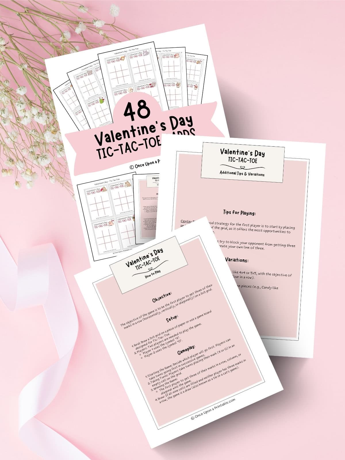 Valentine's day kawaii style tic tac toe cover page with instructions and other tips laying on a pink background with a pink ribbon and baby's breath flowers.