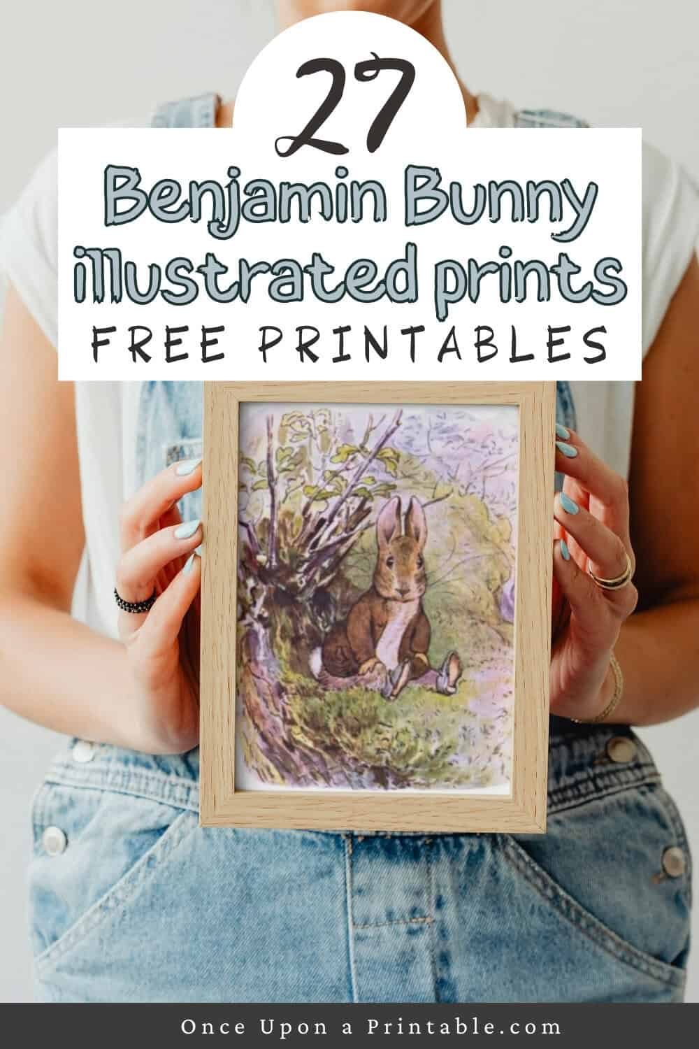 An illustration from the tale of benjamin bunny framed and held in the arms of a woman.