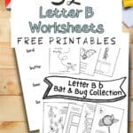 Letter B match the word and picture worksheets laying on a wooden surface with coloring pencils.
