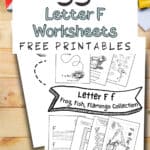 Letter F f fish, frog, and flamingo black and white worksheets for kids laying on a wooden table with coloring pencils.