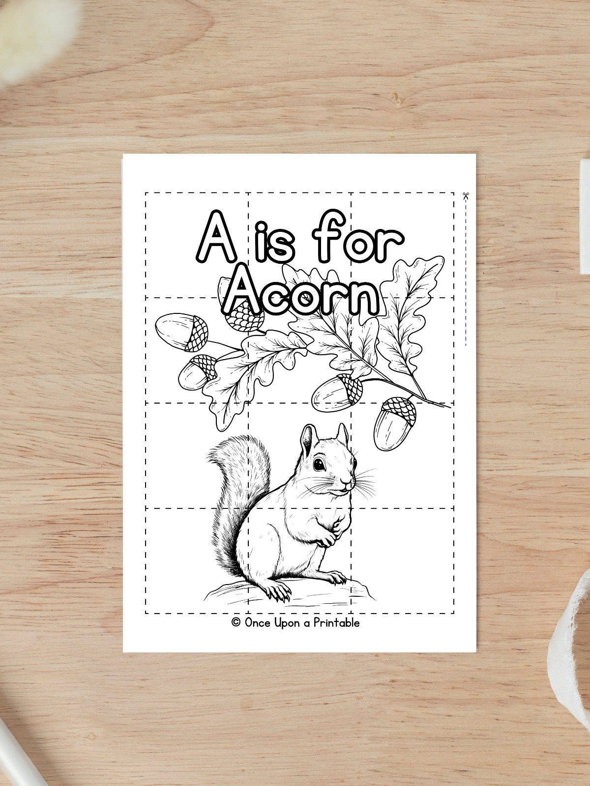 A is for Acorn coloring puzzle worksheet with a squirrel, oak leaves, and acorns.