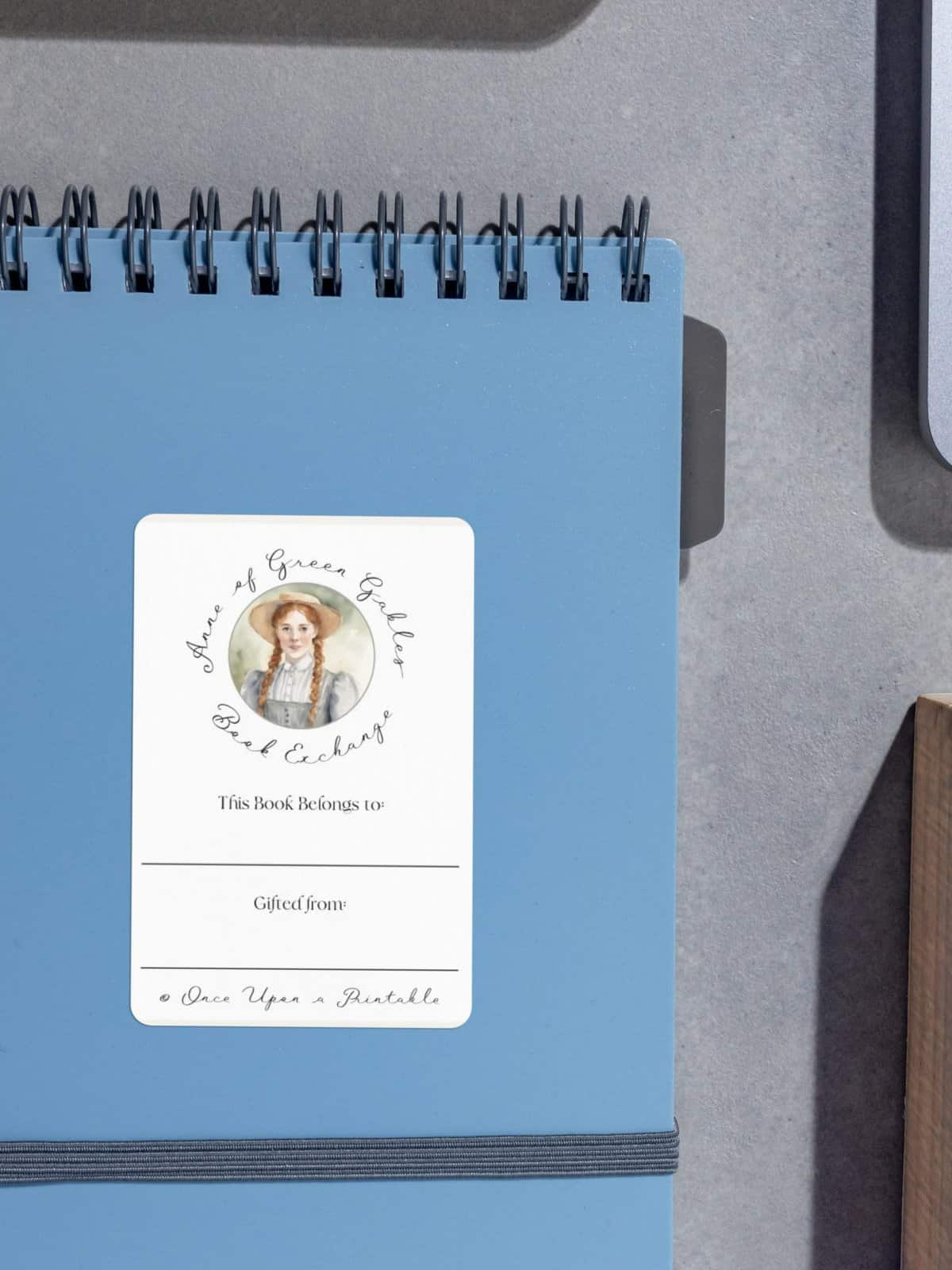 Anne Shirley Book label on a blue notebook.